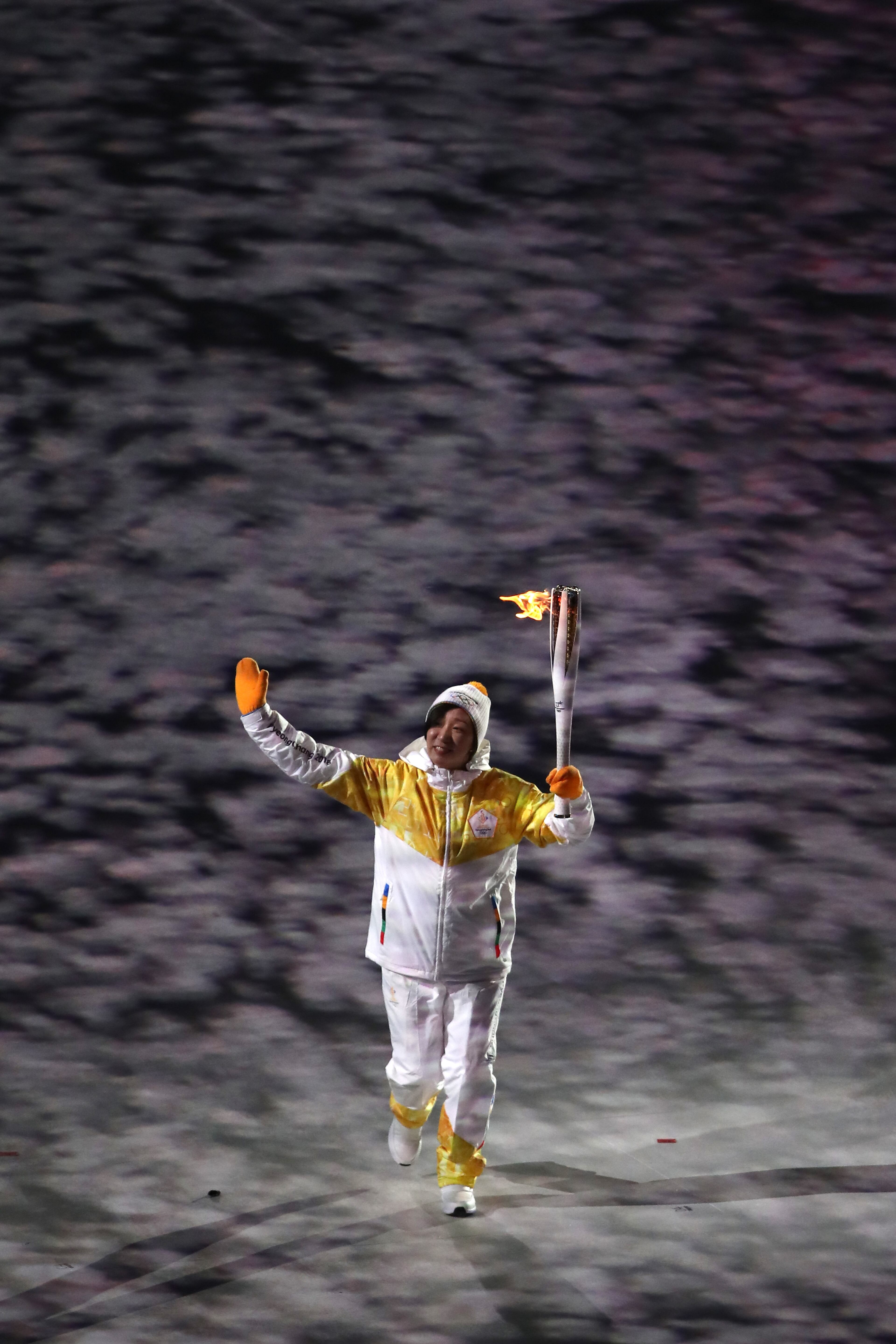 PYEONGCHANG-GUN, SOUTH KOREA - FEBRUARY 09: Torchbearer with the Olympic Flame during the Opening Ceremony of the PyeongChang 2018 Winter Olympic Games at PyeongChang Olympic Stadium on February 9, 2018 in Pyeongchang-gun, South Korea. (Photo by Sean M. Haffey/Getty Images)