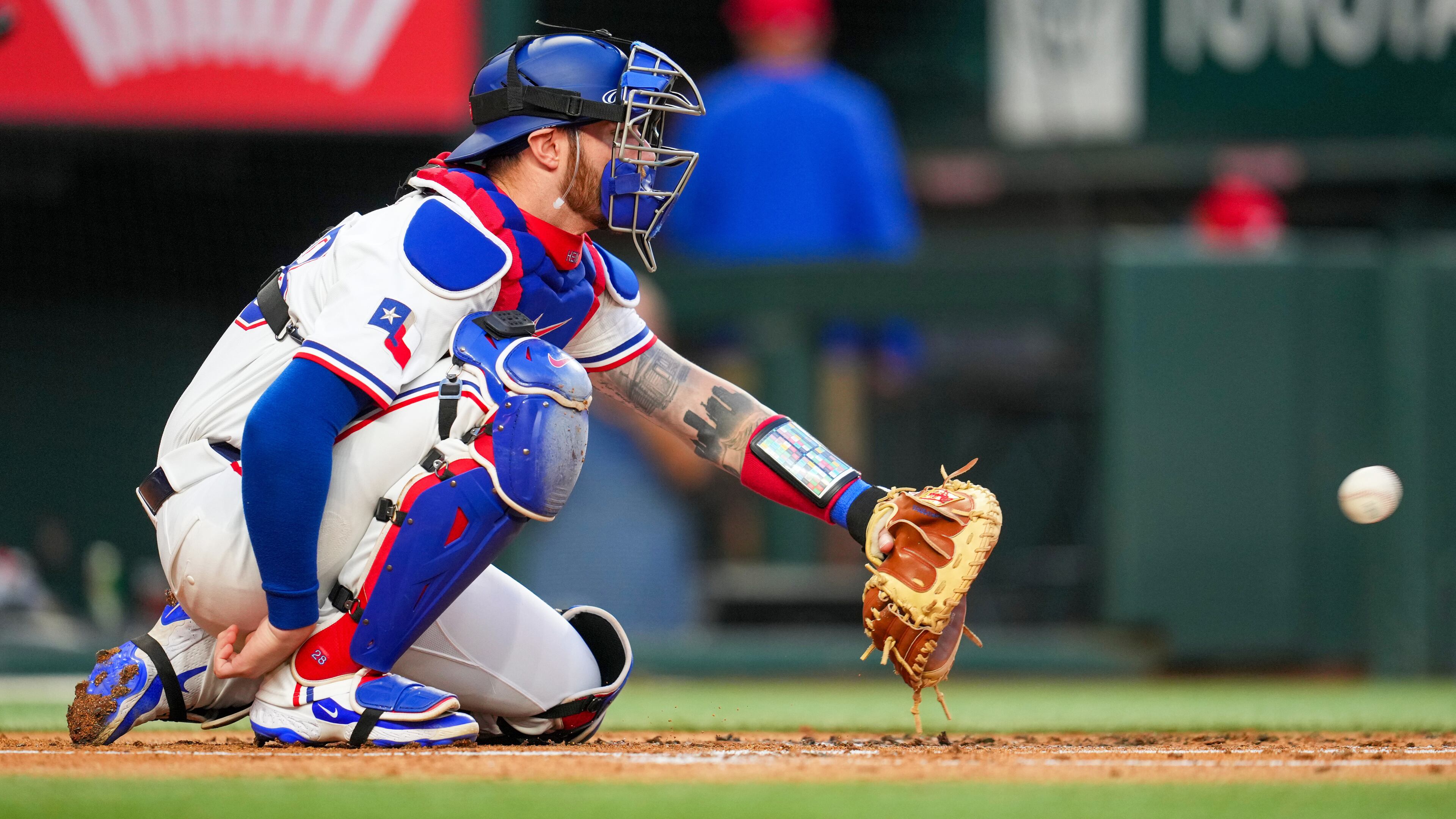 FILE - Texas Rangers catcher Jonah Heim warms up during the second inning of a baseball game against the Milwaukee Brewers, Sept. 8, 2025, in Arlington, Texas. (AP Photo/Julio Cortez, File)