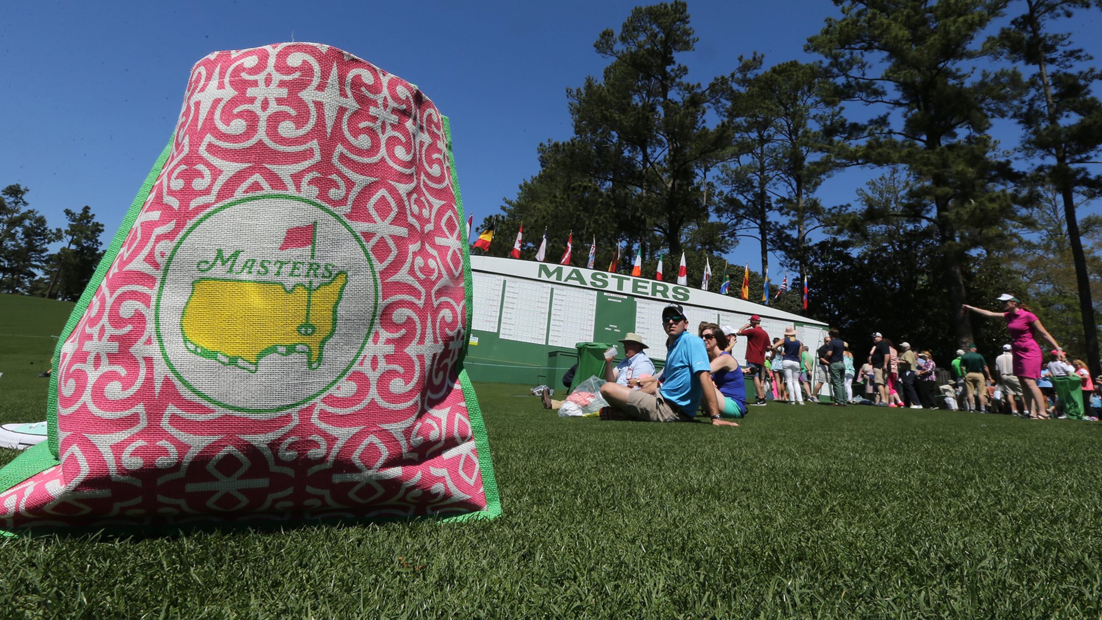 Fans relax and watch the practice rounds along the first fairway at Augusta National Golf Club on Sunday, April 2, 2017, in Augusta. Curtis Compton/ccompton@ajc.com