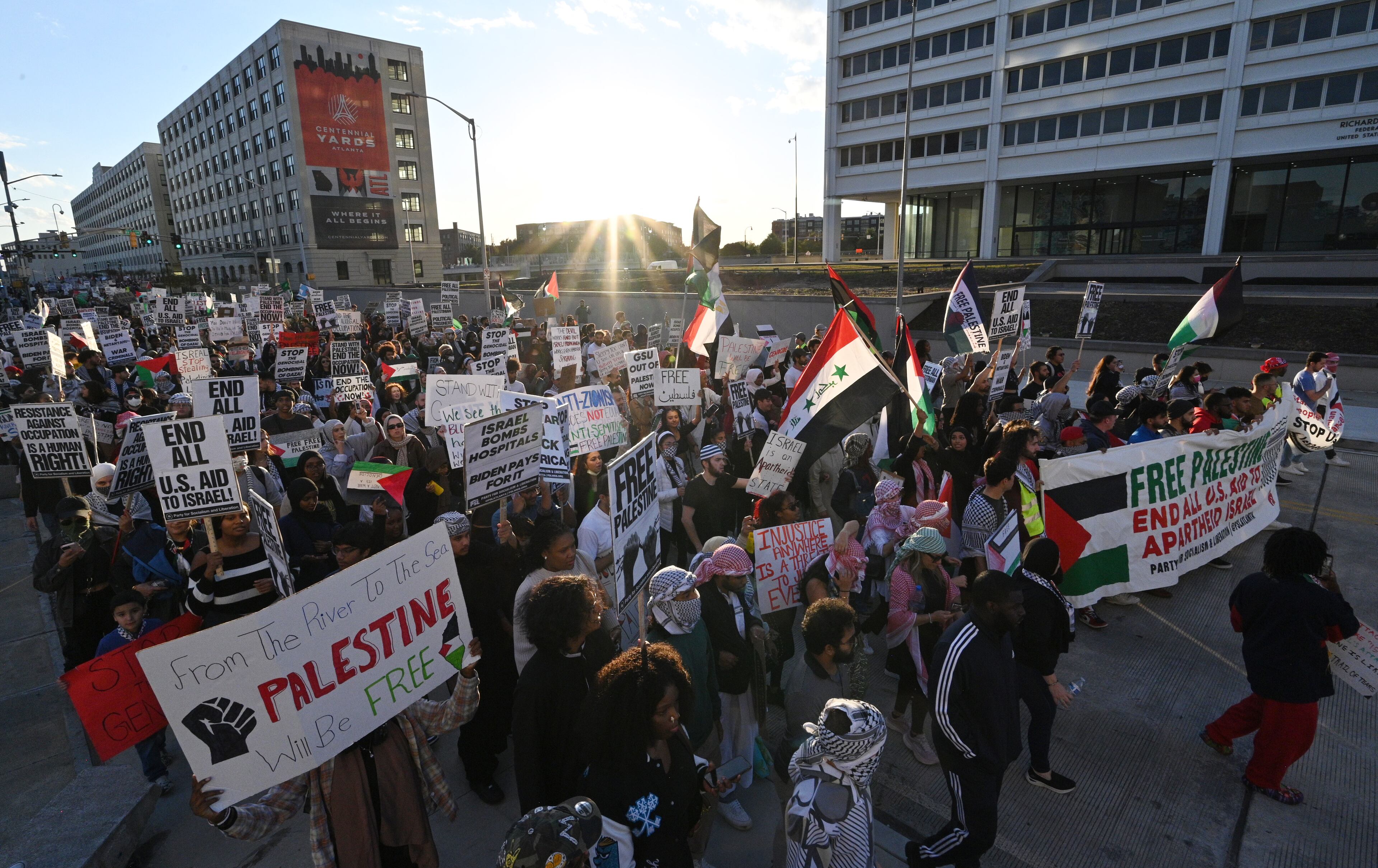 Pro-Palestinian supporters holding signs march during a rally, Friday, October 20, 2023, in Atlanta. Hundreds gathered in downtown Atlanta to march in support of Palestine. (Hyosub Shin / Hyosub.Shin@ajc.com)