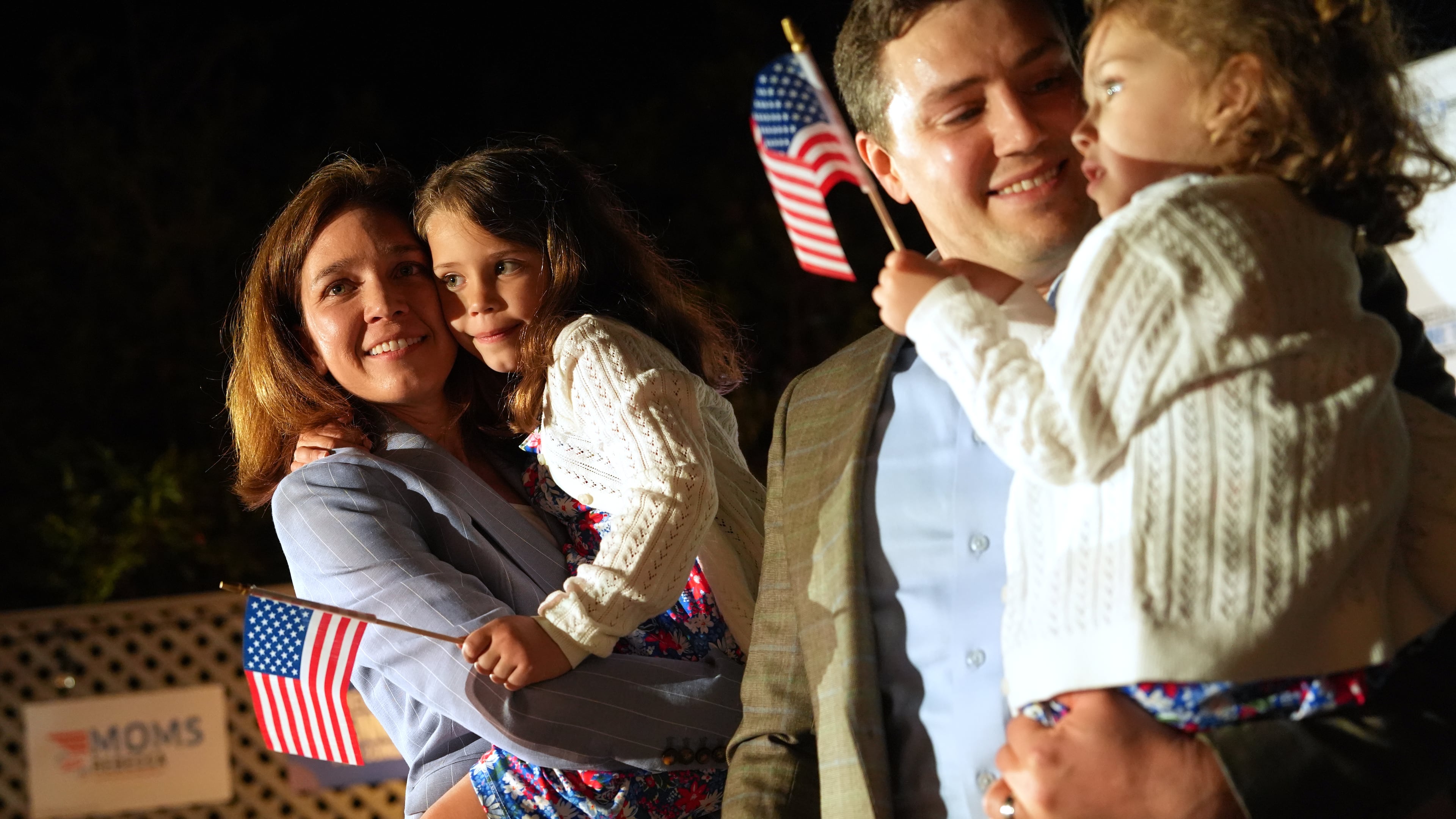 From left, Rebecca Bennett, Democratic candidate for New Jersey's 7th Congressional District, holds her daughter Rosie, alongside her husband Alex Hydrean and daughter Millie during a primary election night watch party after winning the Democratic nomination Tuesday, June 2, 2026, in Bridgewater, N.J. (AP Photo/Ryan Murphy)