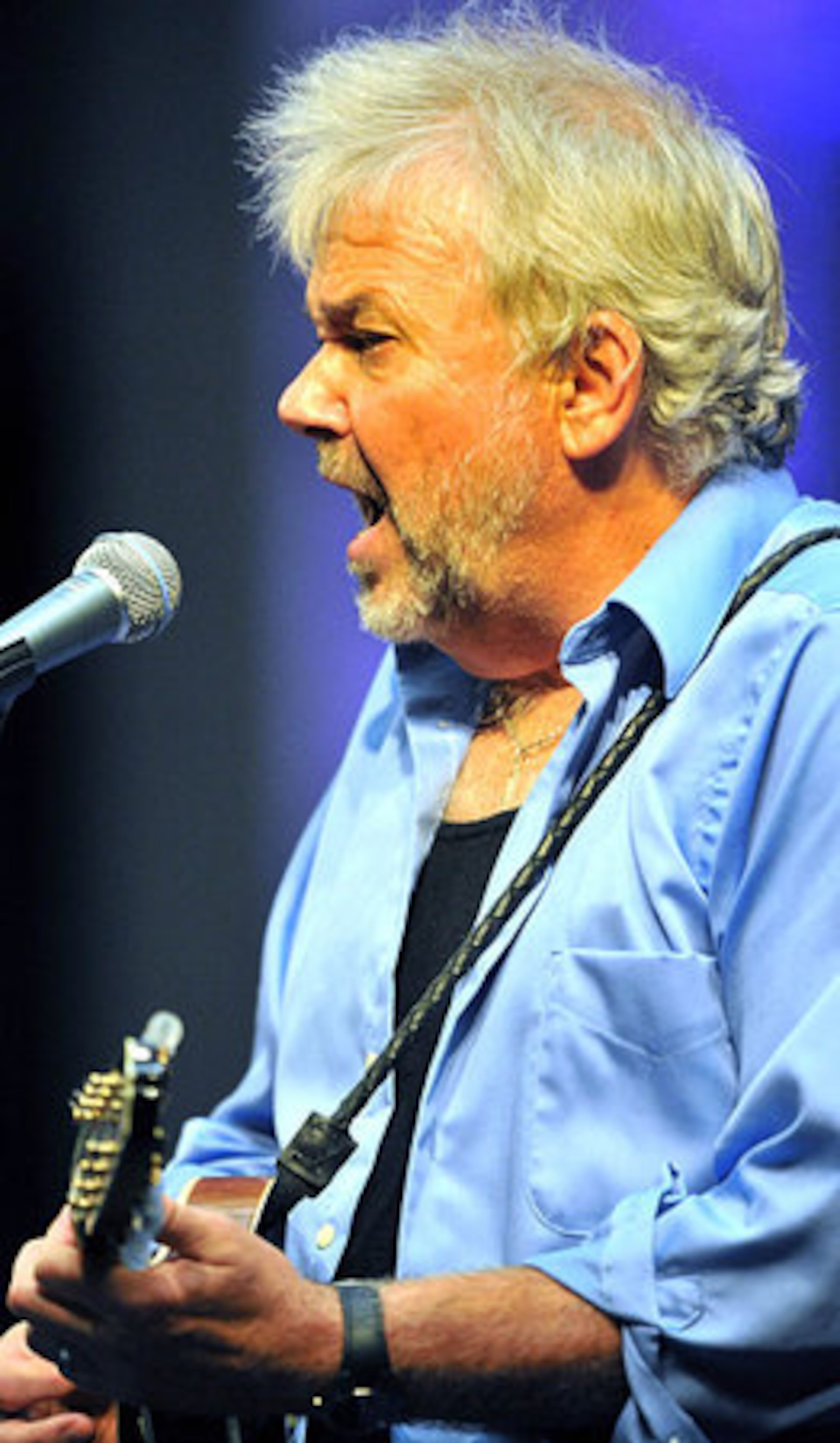Rickie Simpkins performs during the Emmylou Harris concert Friday night at the Atlanta Botanical Garden in Atlanta.