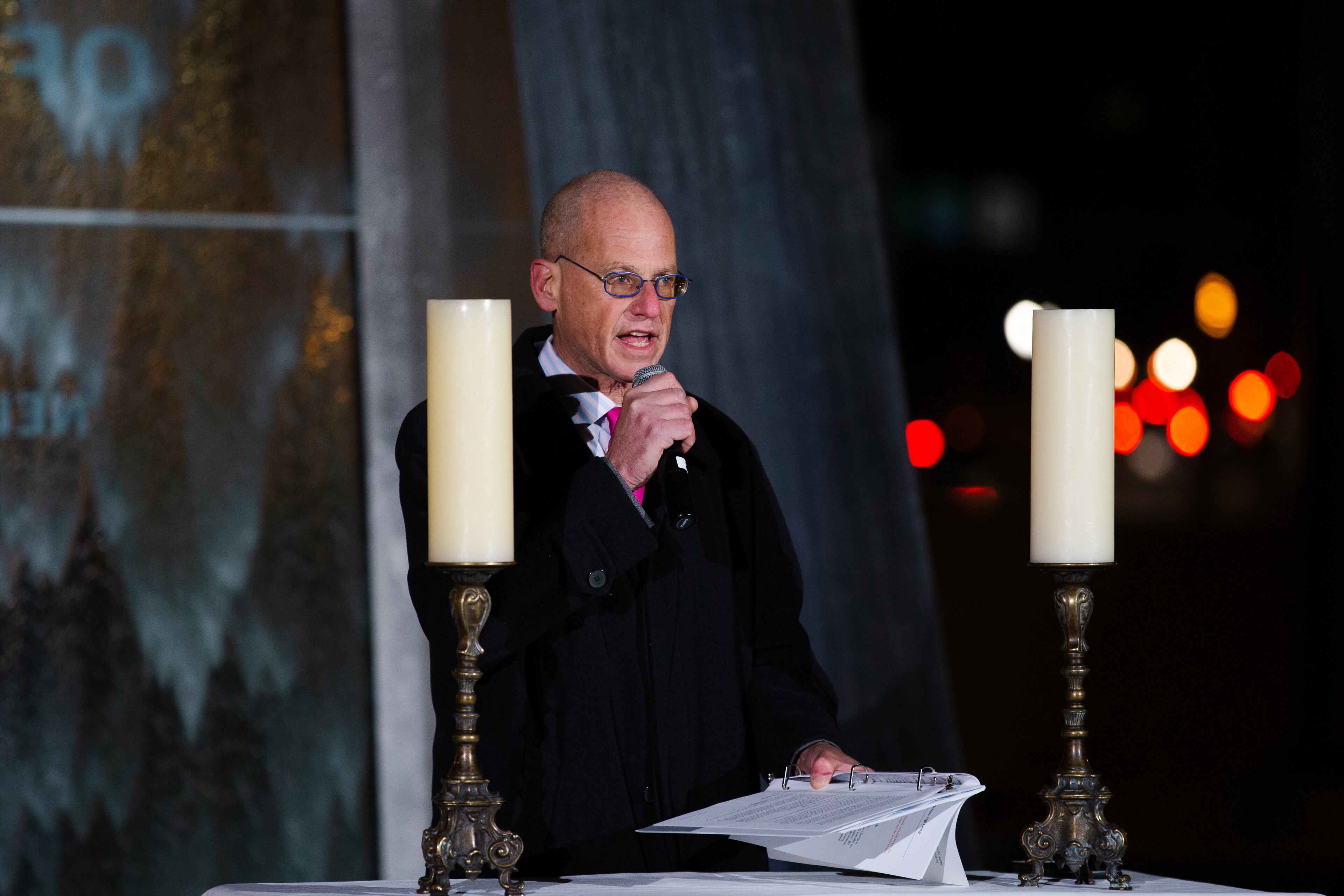 Eric Robbins, president of the Jewish Federation, speaks during a prayer vigil on Sunday, January 3, 2021, outside the National Center for Civil and Human Rights in Atlanta. Faith and community leaders lead the candlelight pre-election interfaith vigil as a way to mitigate violence and promote unity ahead of the U.S. Senate runoff election. CHRISTINA MATACOTTA FOR THE ATLANTA JOURNAL-CONSTITUTION