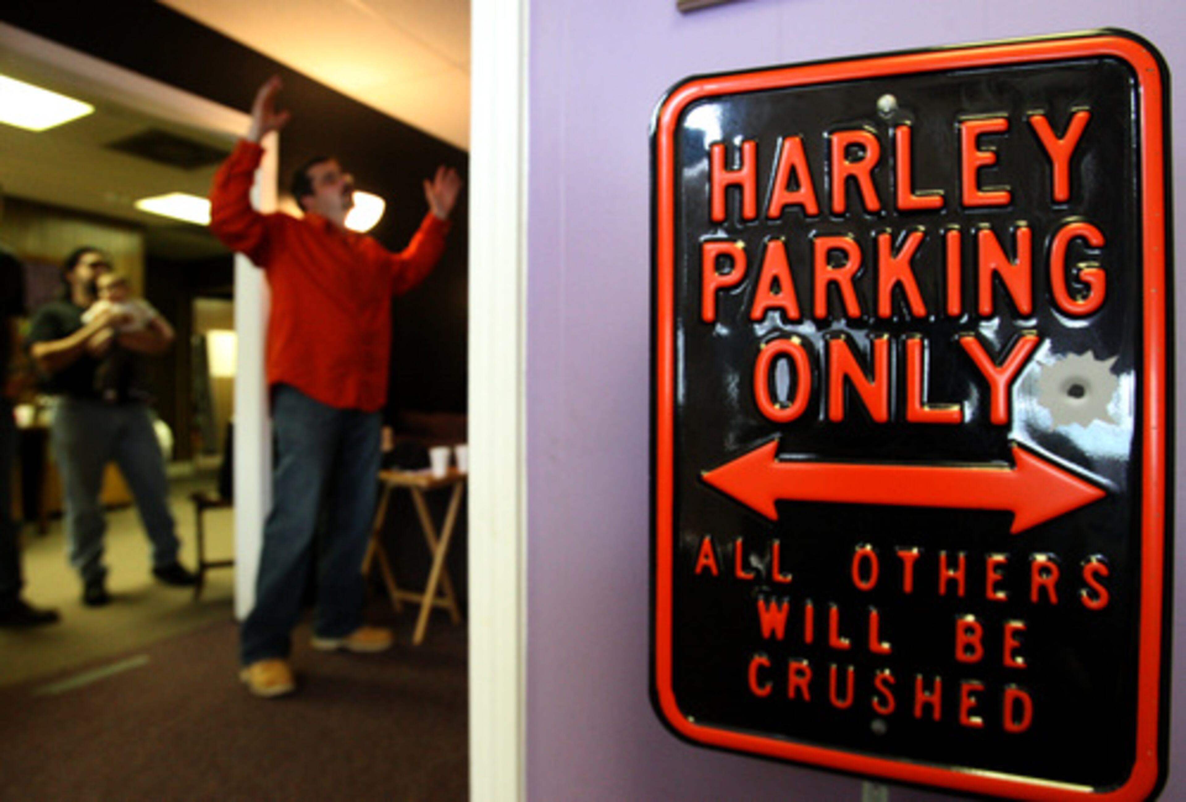 The brightly-lit storefront space serves as a sanctuary for nearly 50 worshippers, and rows of oversized loveseats and chairs are their pews.