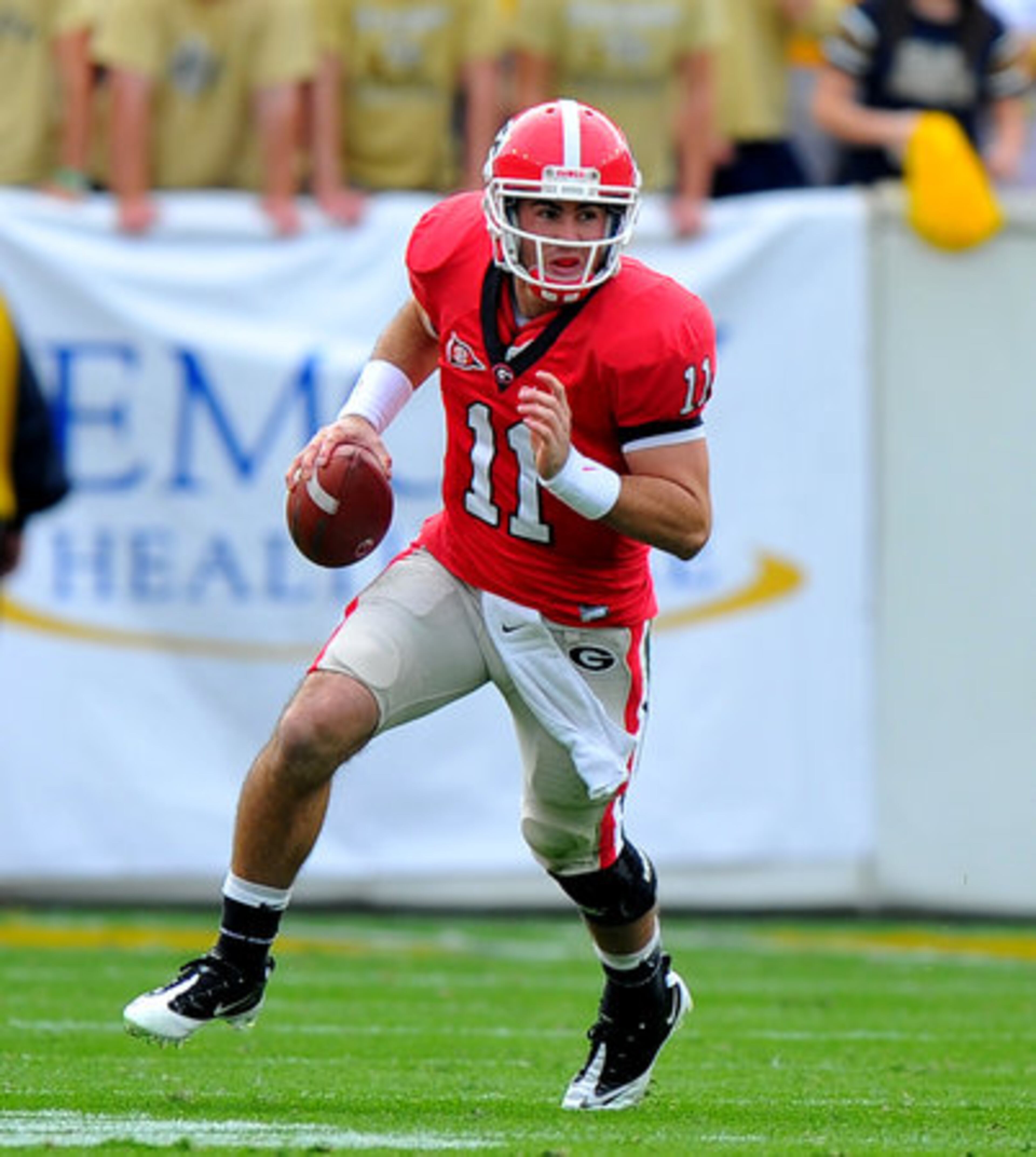 UGA quarterback Aaron Murray rolls out of the pocket during the second quarter. He had a productive day, with four touchdowns.