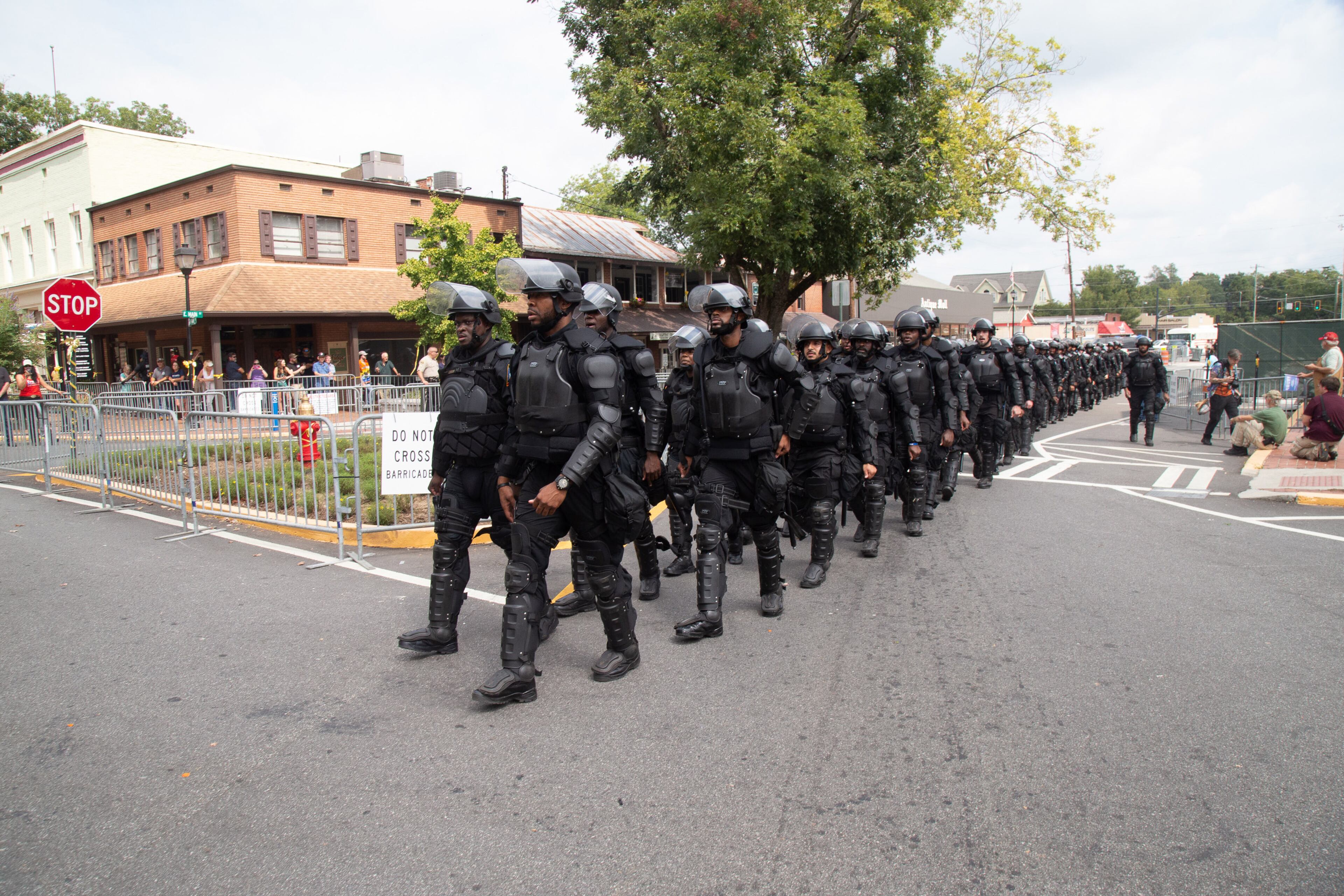 Police march into the Dahlonega square before the start of a pro-Trump rally Saturday in Dahlonega, on September 14, 2019. STEVE SCHAEFER / SPECIAL TO THE AJC