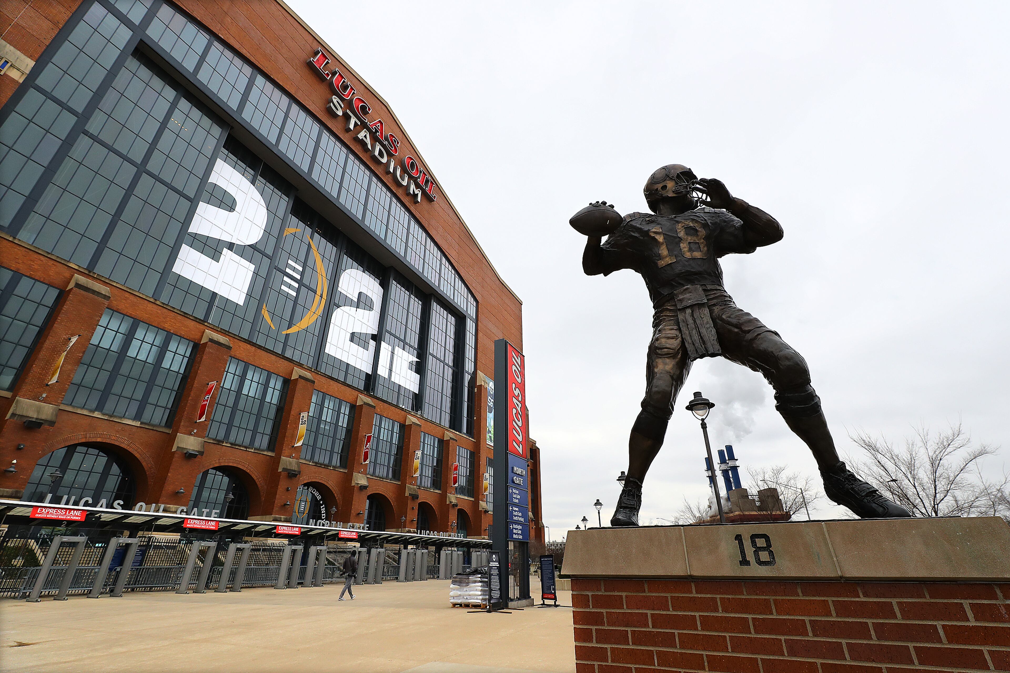 010622 Indianapolis: A bronze statue of "The Sheriff" Peyton Manning, the Indianapolis Colts quarterback 1998-2011, is seen outside Lucas Oil Stadium on Thursday, Jan. 6, 2022, where Georgia will play Alabama for the national championship in Indianapolis. “Curtis Compton / Curtis.Compton@ajc.com”`