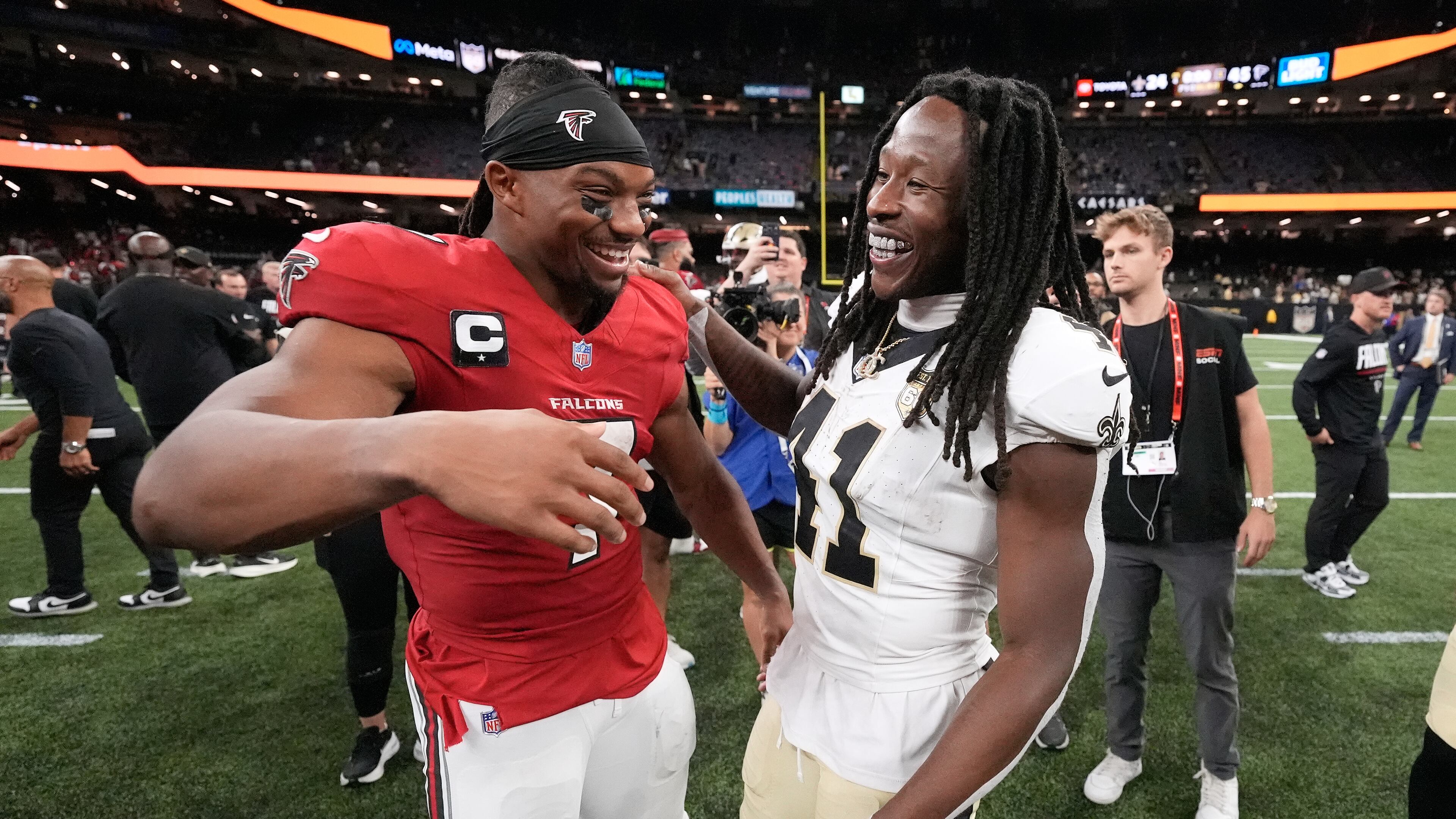 Atlanta Falcons running back Bijan Robinson (left) greets New Orleans Saints running back Alvin Kamara after an NFL football game in New Orleans, Monday, Oct. 5, 2026. (Gerald Herbert/AP)
