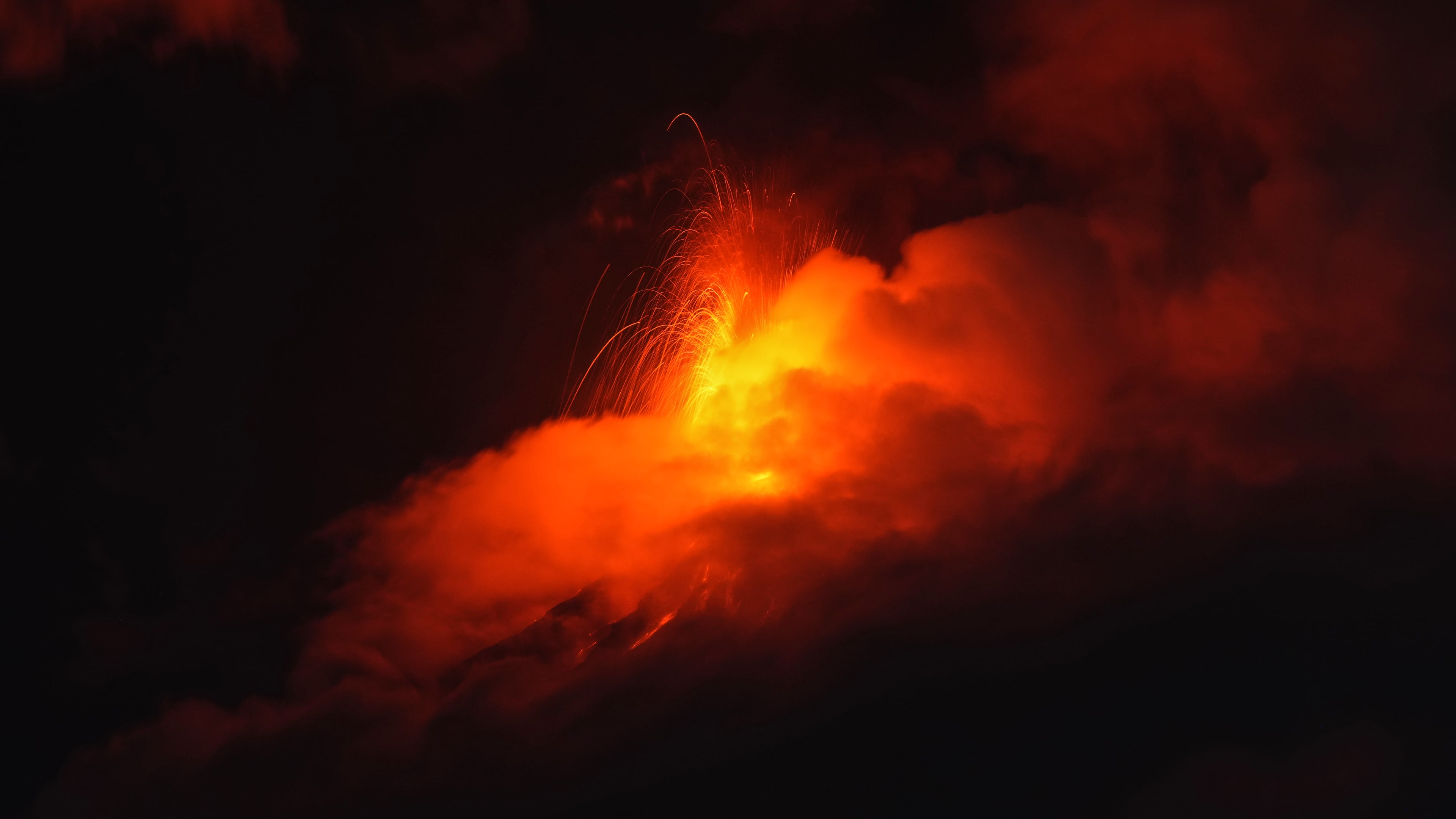 Lava flows out of the crater of the Fuego Volcano, as seen from San Juan Alotenango, Guatemala, Tuesday, Aug. 4, 2026. (AP Photo/Moises Castillo)