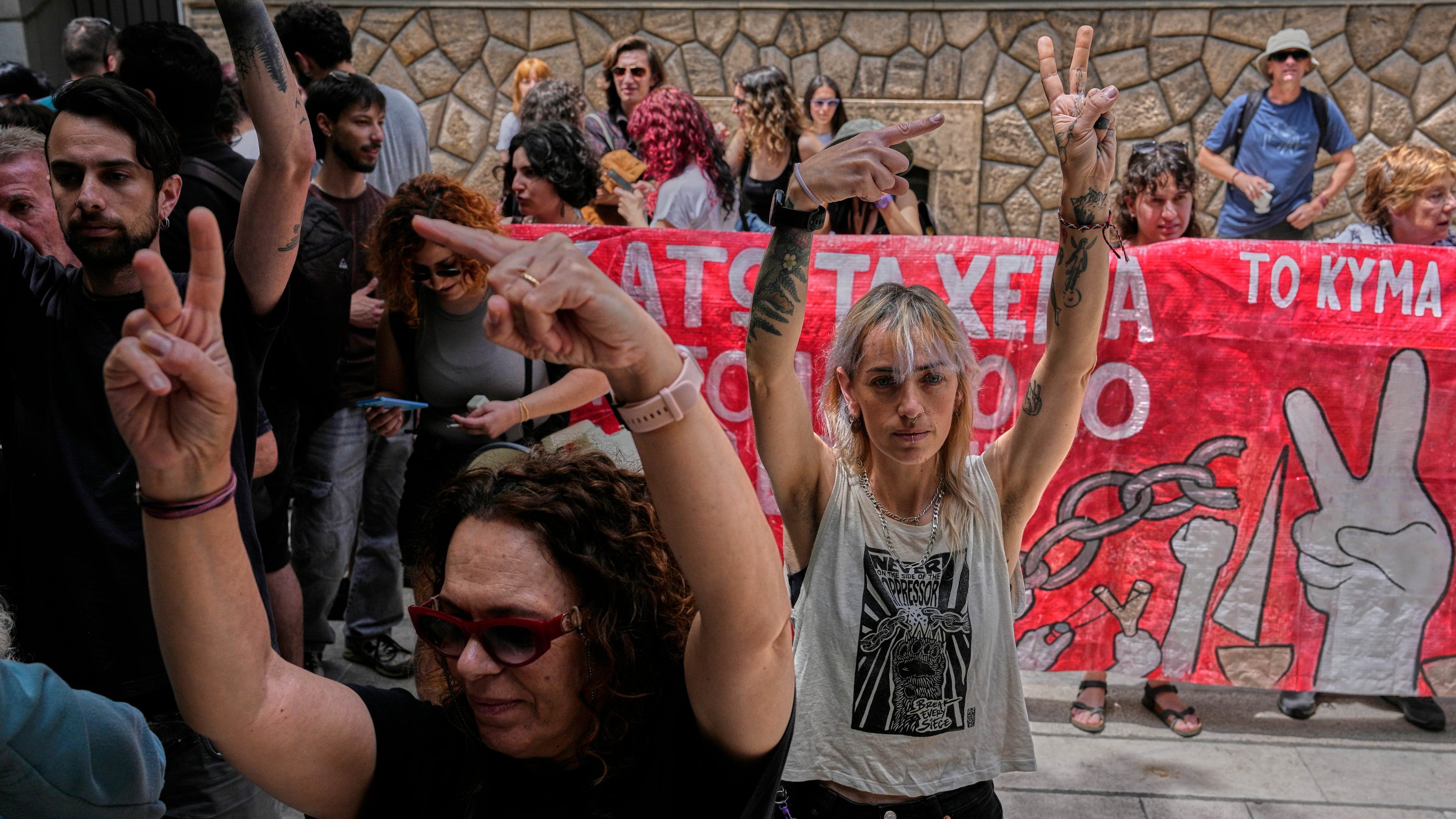 Protesters chant pro-Palestinian slogans outside Greece's Foreign Ministry after Israel's navy intercepted an activist flotilla in waters off of Cyprus, in Athens, Tuesday, May 19, 2026. (AP Photo/Thanassis Stavrakis)