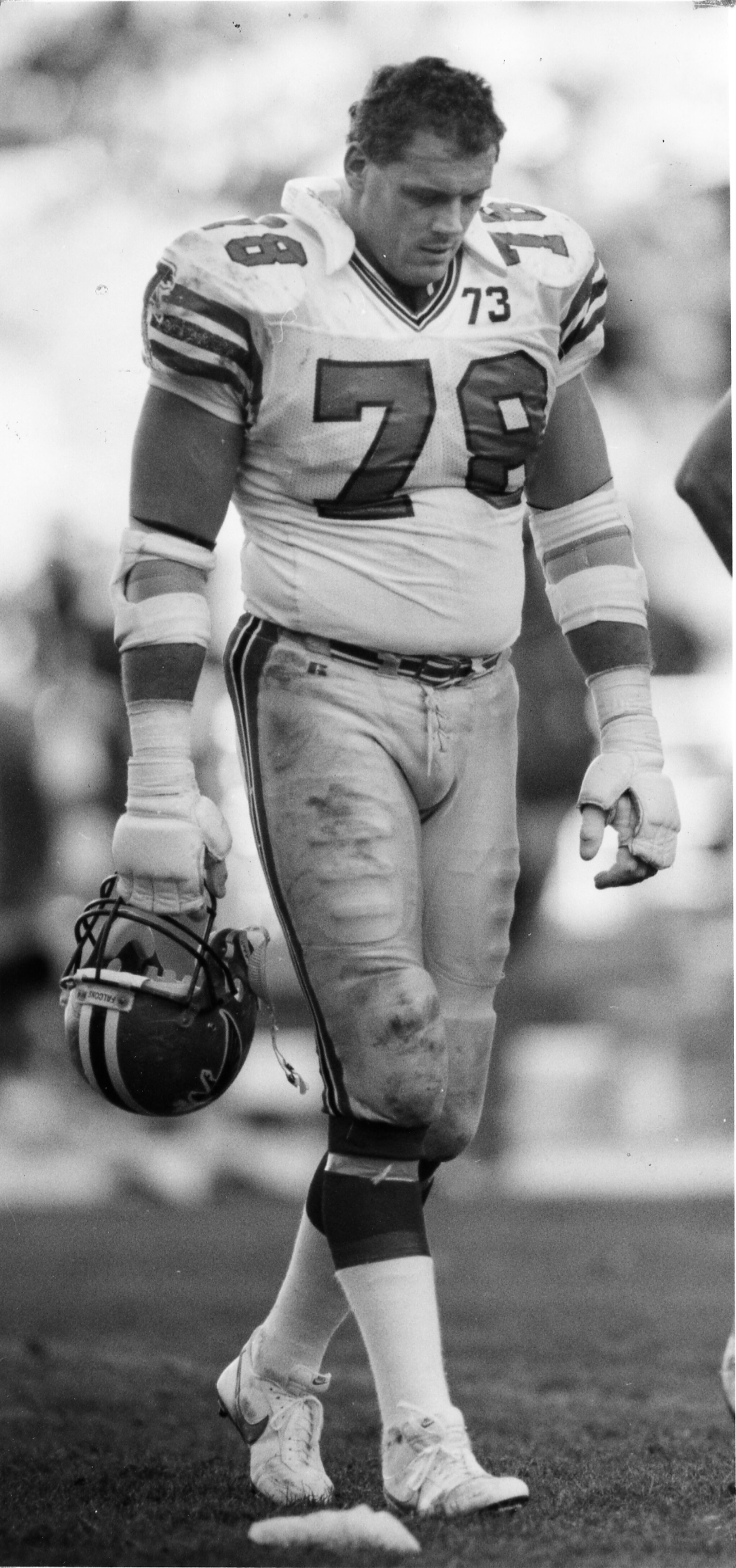Falcons offensive tackle Mike Kenn walks off the field in the final minute of play after the 49ers' Johnny Jackson intercepted a Chris Miller pass on the Falcons' final drive of the day. Dec. 3, 1989. (Frank Niemeir/AJC archives)