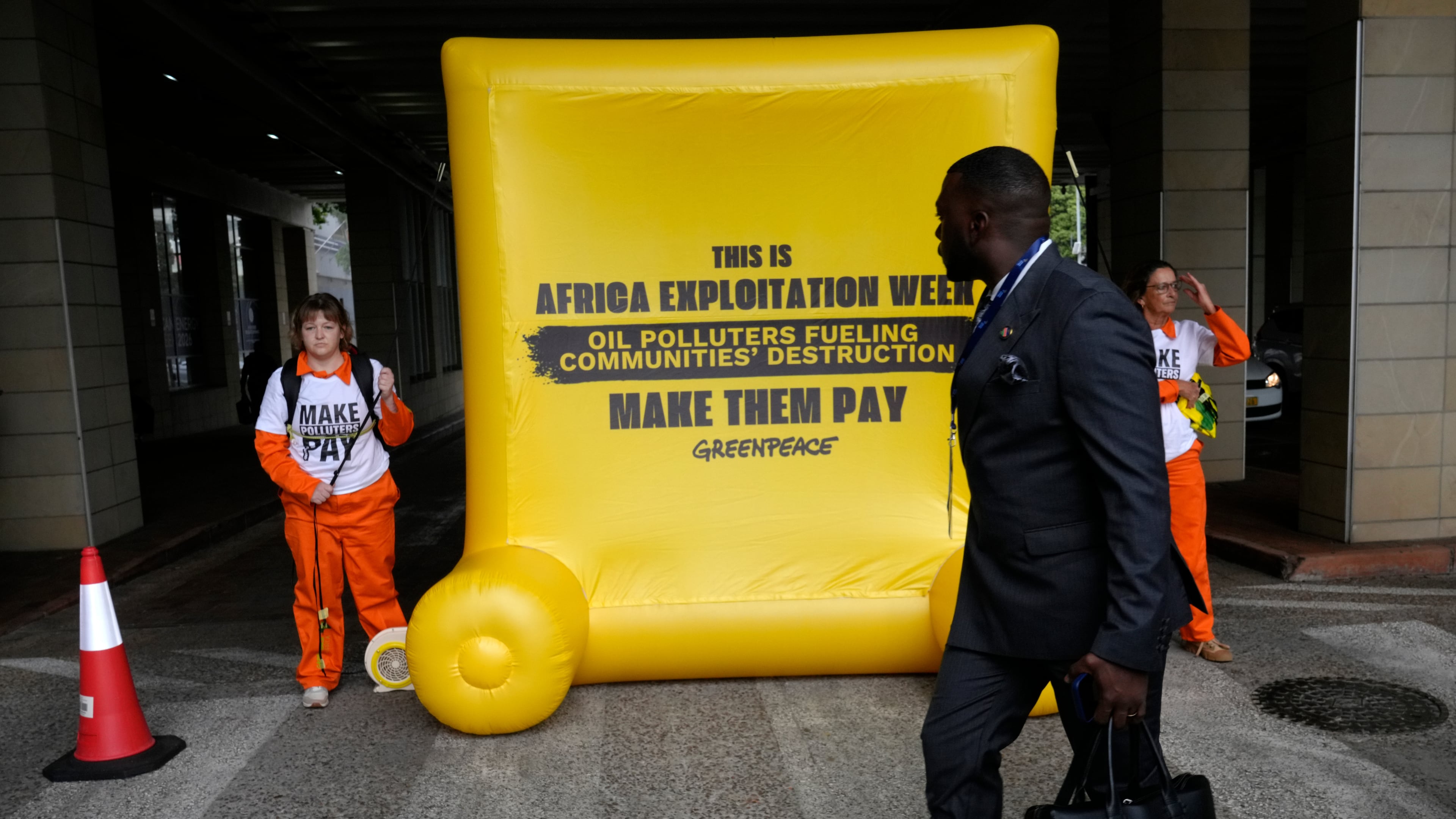 Greenpeace Africa activists protest at the African Energy Week in Cape Town, South Africa, Tuesday, Oct. 13, 2026. (AP Photo/Nardus Engelbrecht)