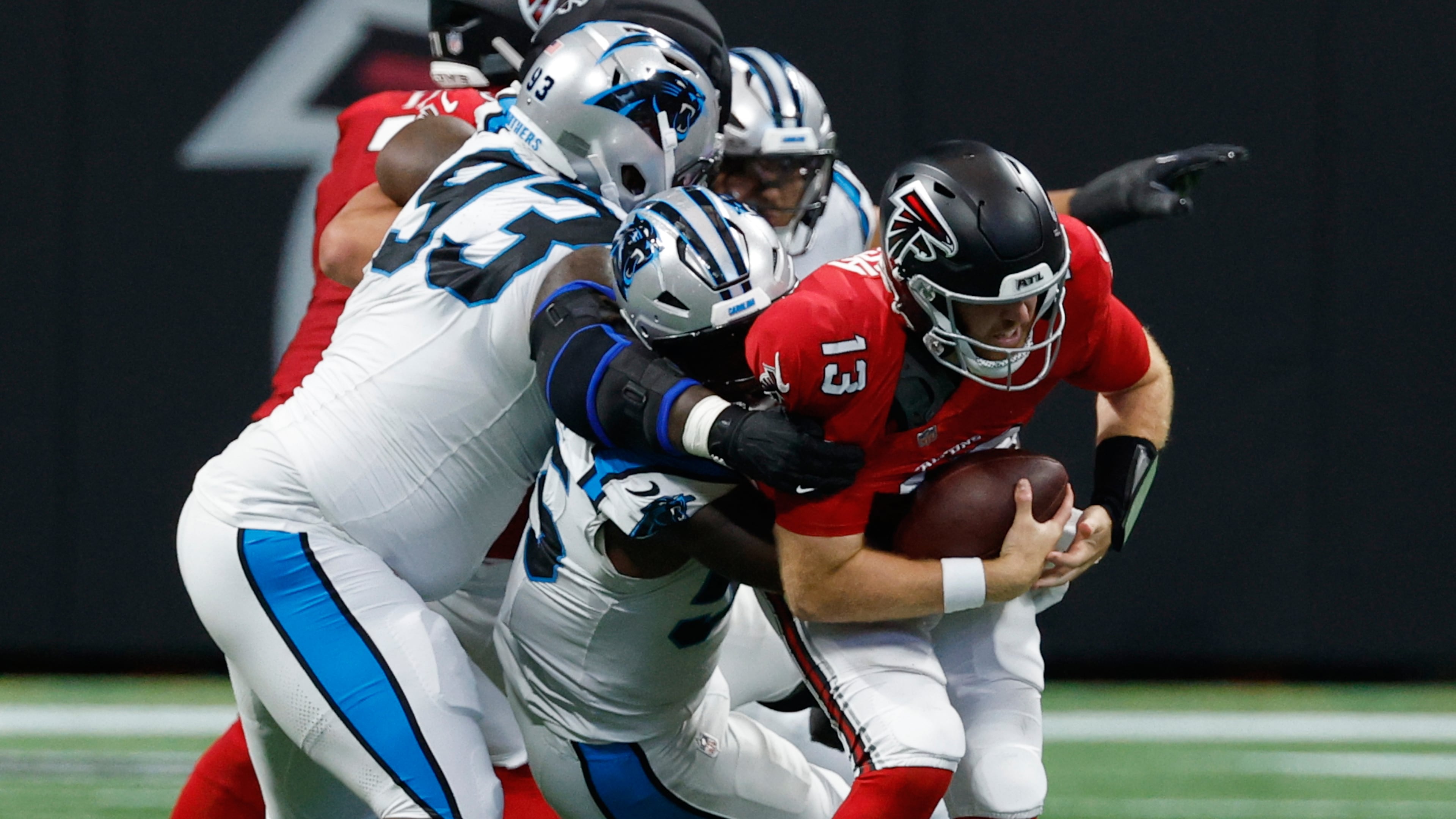 Atlanta Falcons quarterback Cooper Rush (13) is sacked during an NFL football game in Atlanta, Sunday, Sept. 20, 2026. (AP Photo/Erik S. Lesser)