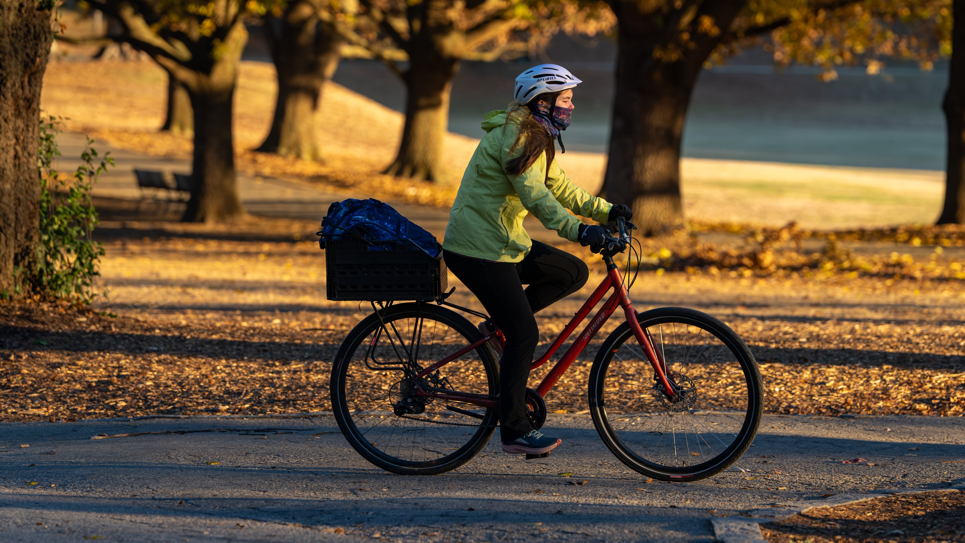 A woman rides a bicycle through Piedmont Park amid below-freezing temperatures Monday. (Ben Hendren for the AJC)