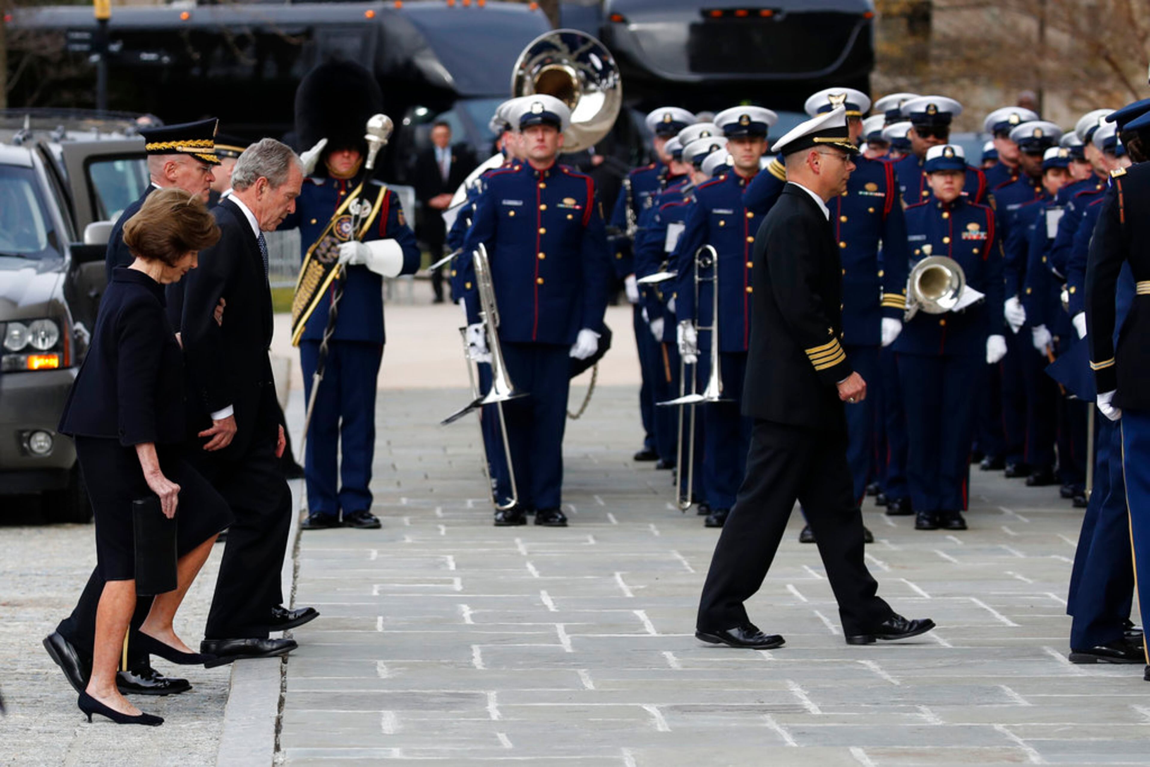Former President George W. Bush and Laura Bush follow the casket of former President George H.W. Bush into a State Funeral at the National Cathedral, Wednesday, Dec. 5, 2018, in Washington. (AP Photo/Alex Brandon, Pool)