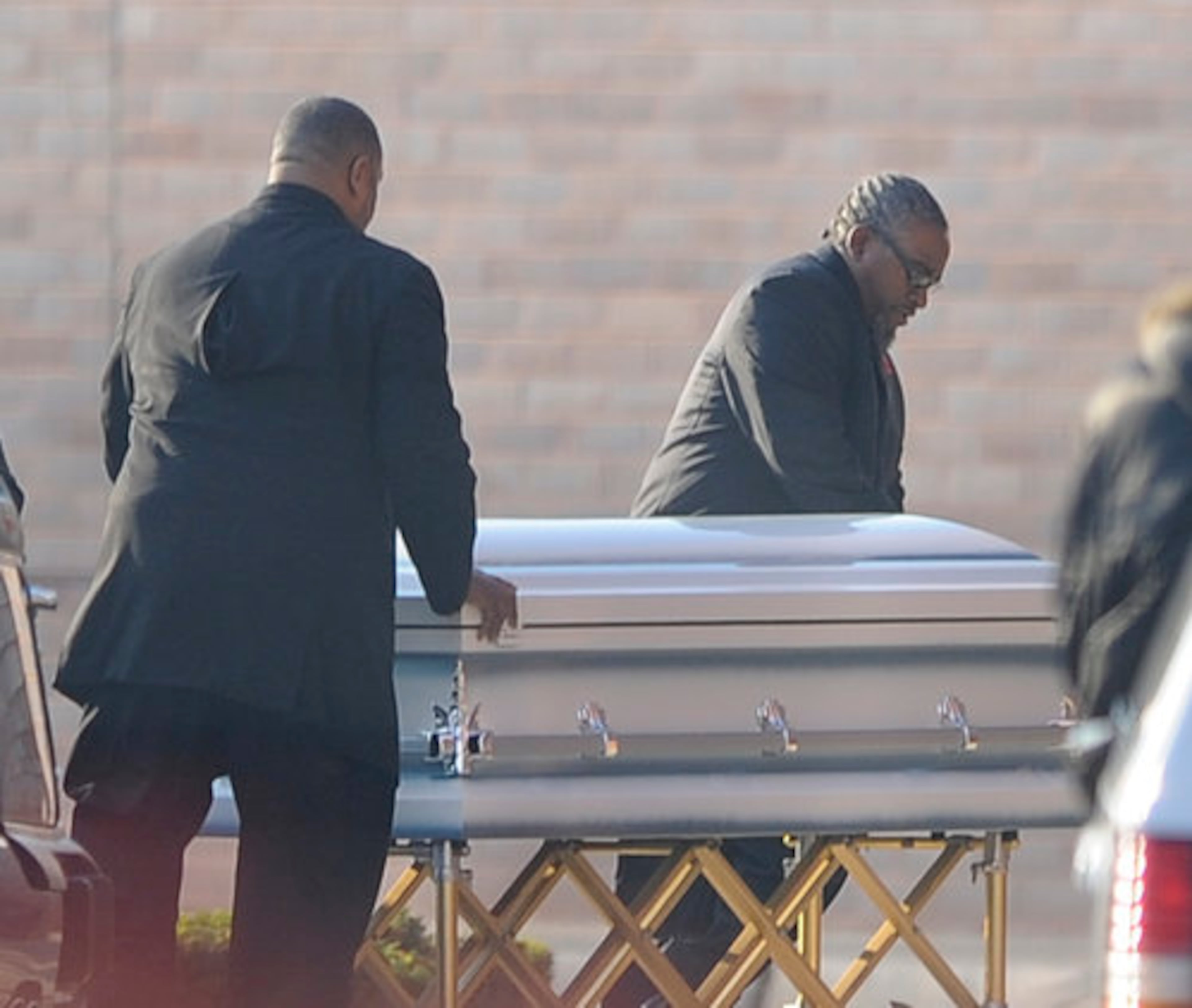 The three were shot late last month. No one is charged although authorities call the boy's estranged stepfather a "person of interest."