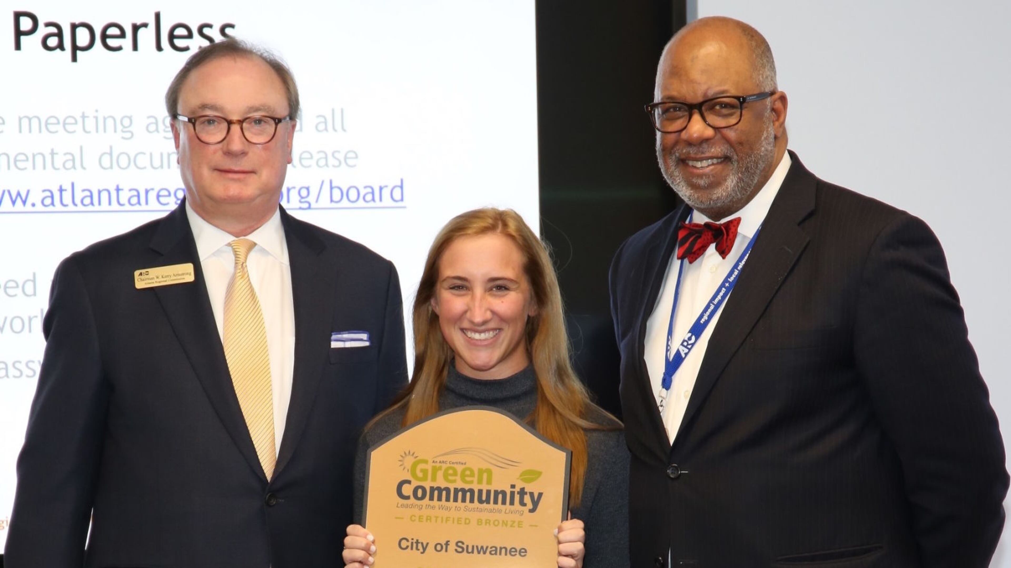 Suwanee City Planner Jylie Adams, center, poses with Atlanta Regional Commission Chariman Kerry Armstrong, left, and Executive Director Doug Hooker after receiving the city’s Green Community recognition. Courtesy City of Suwanee