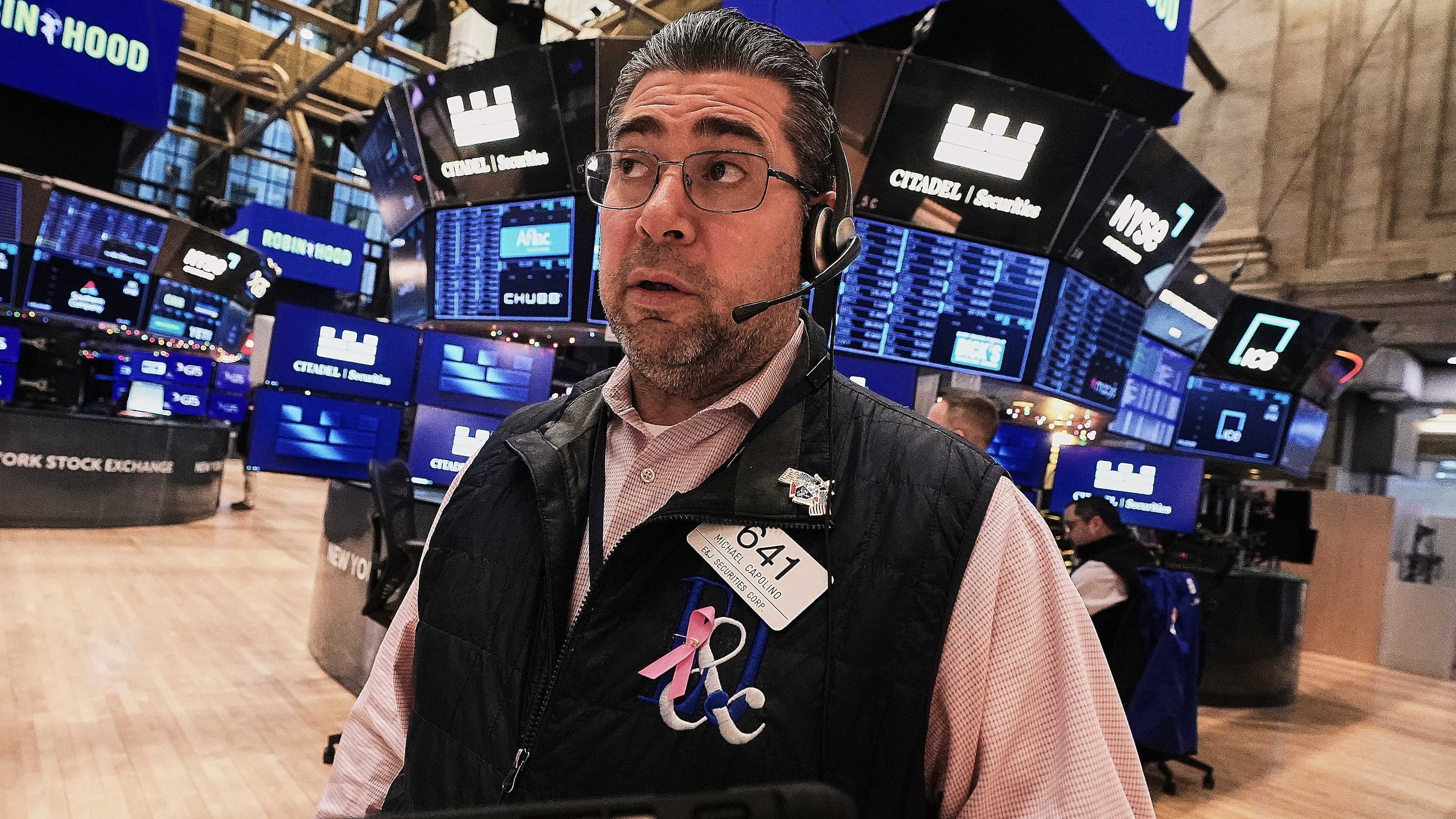 Trader Michael Capolino works on the floor of the New York Stock Exchange, Friday, Jan. 2, 2026. (AP Photo/Richard Drew)