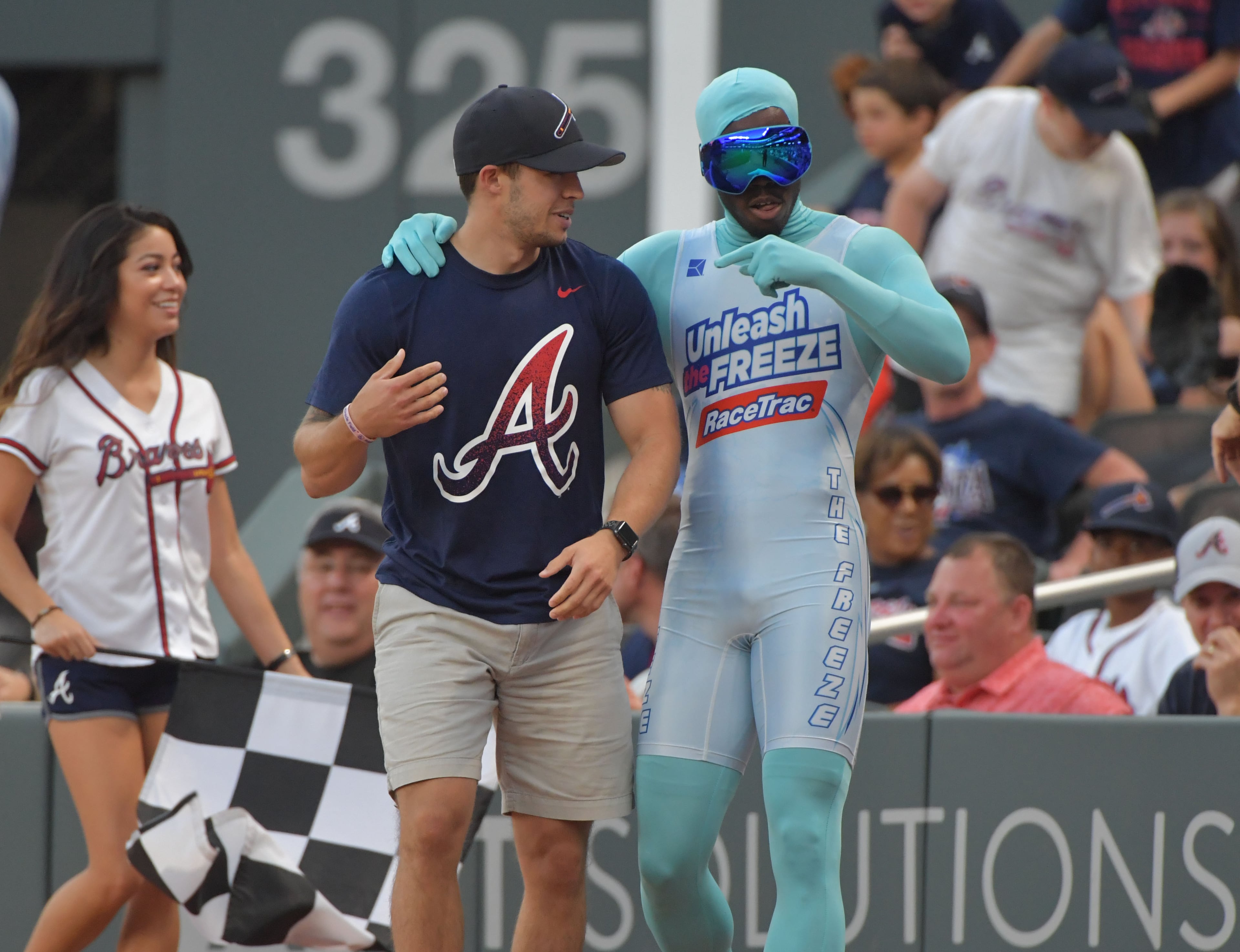 June 16, 2017 Atlanta - The Atlanta Braves' newest sensation "The Freeze" congratulates a fan after the fan beat him in a race during Atlanta Braves home game at SunTrust Park on Friday, June 16, 2017. HYOSUB SHIN / HSHIN@AJC.COM
