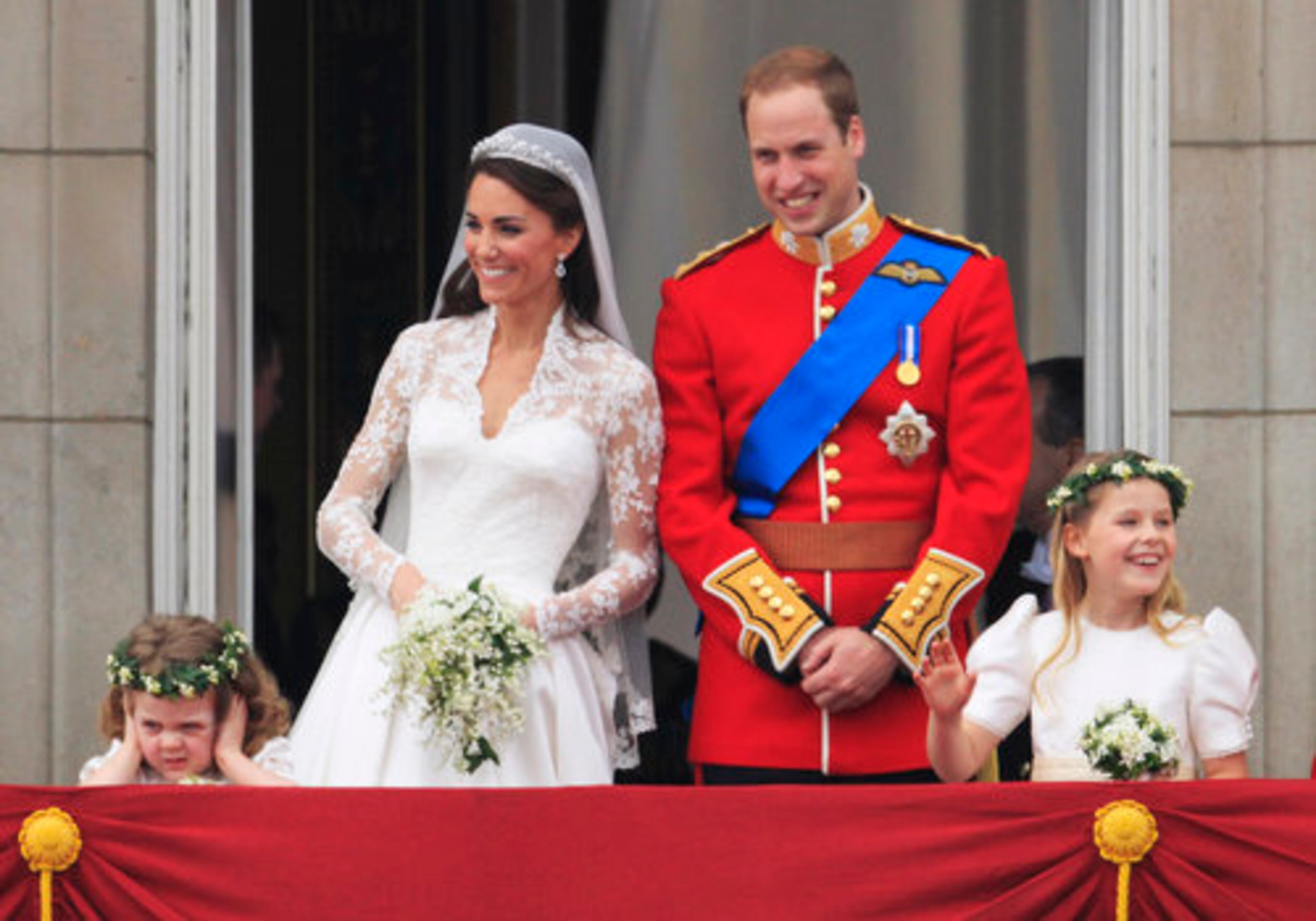 Britain's Prince William and his wife Kate, Duchess of Cambridge stand on the balcony of Buckingham Palace after the Royal Wedding in London Friday, April, 29, 2011.