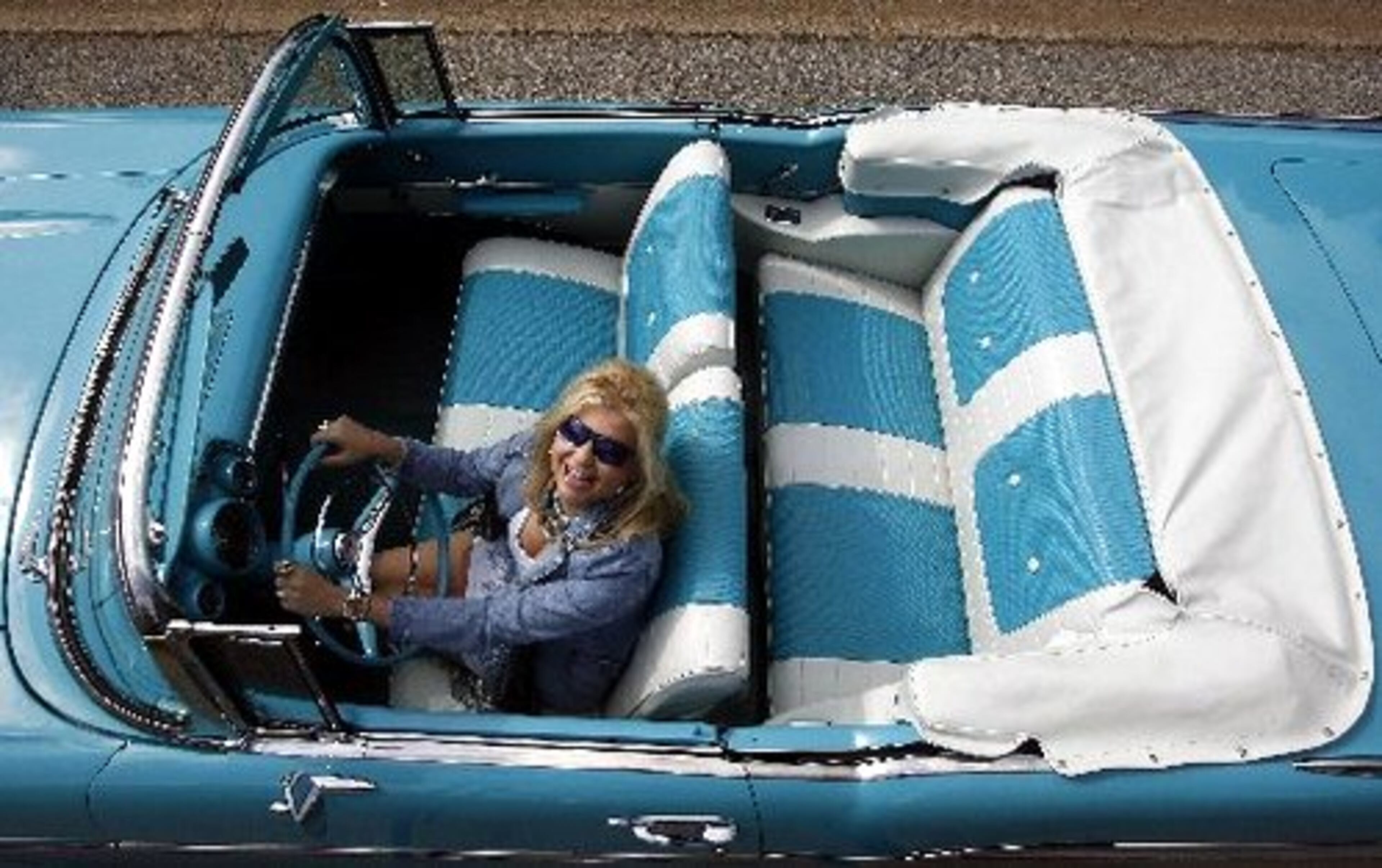 Heaven with the top down: Looking like an ad from a glossy magazine of the 1950s, Tevie Dante Fraser enjoys the ride in a Bel Air convertible. The outdoor life can be beautiful.