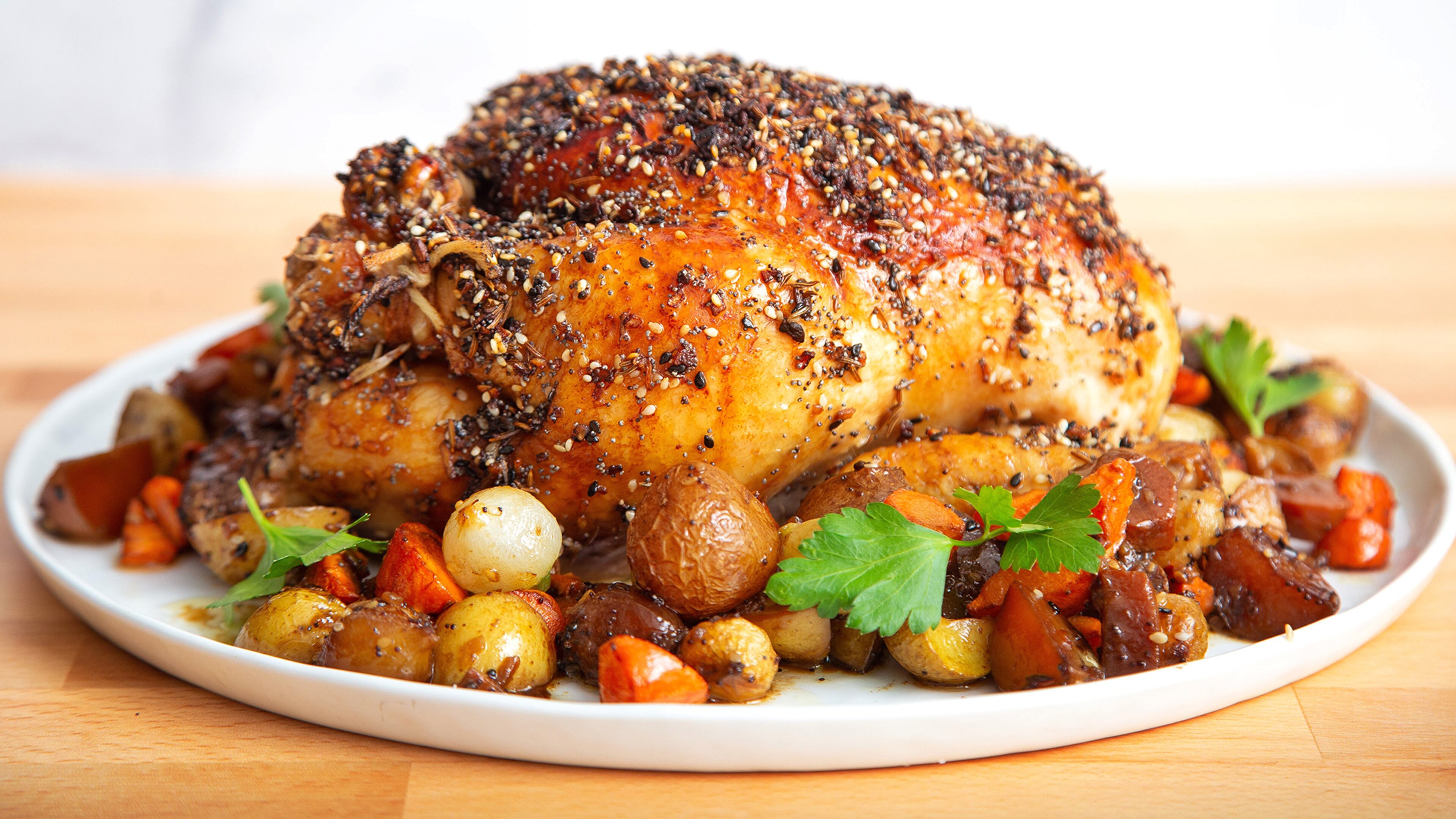 Enjoy a favorite breakfast taste at dinnertime with Everything Bagel-crusted Roast Chicken with Root Vegetables. (Courtesy of Brooke Slezak)