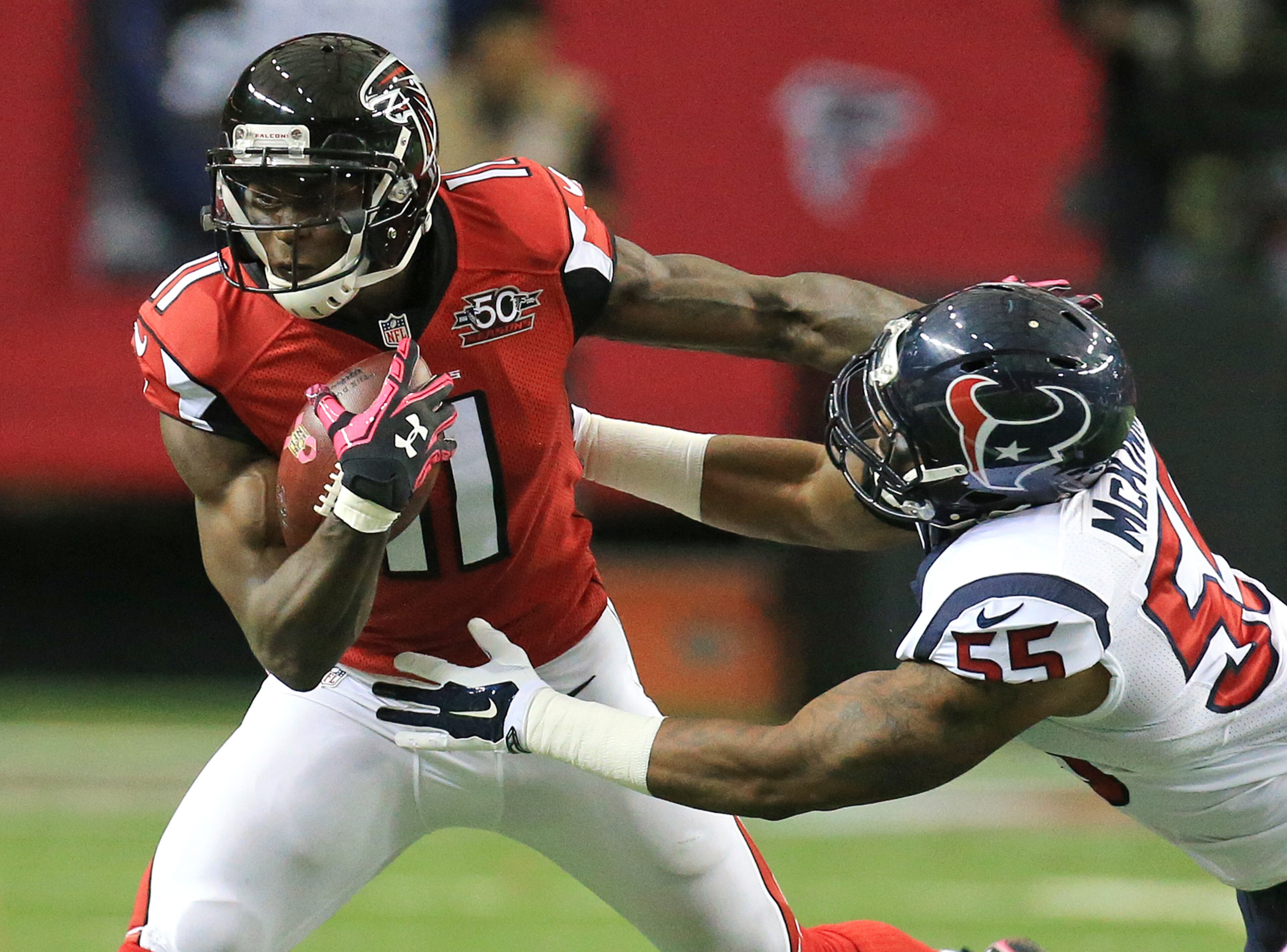 Falcons wide receiver Julio Jones makes a reception against Texans linebacker Benardick McKinney during the first half in a football game on Sunday, Oct. 4, 2015, in Atlanta. The Falcons beat the Texans 48-21 to improve their record to 4-0.