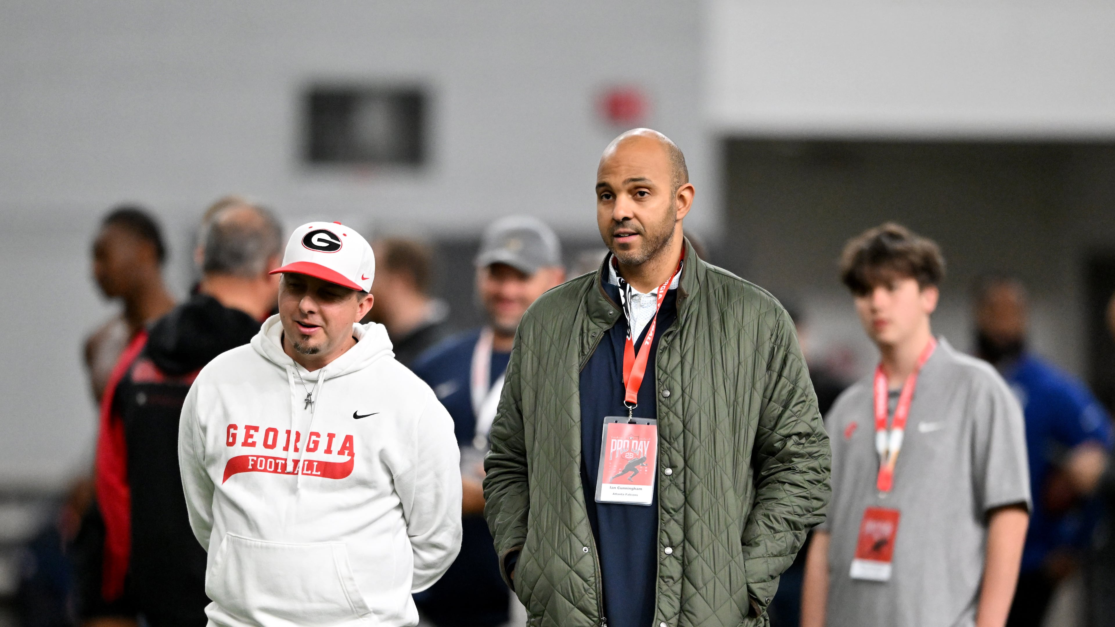 Falcons general manager Ian Cunningham (right) — pictured at Georgia's NFL pro day in Athens in March — has just five picks to work with in the NFL draft, with Atlanta's earliest pick the 48th overall. (Hyosub Shin/AJC)