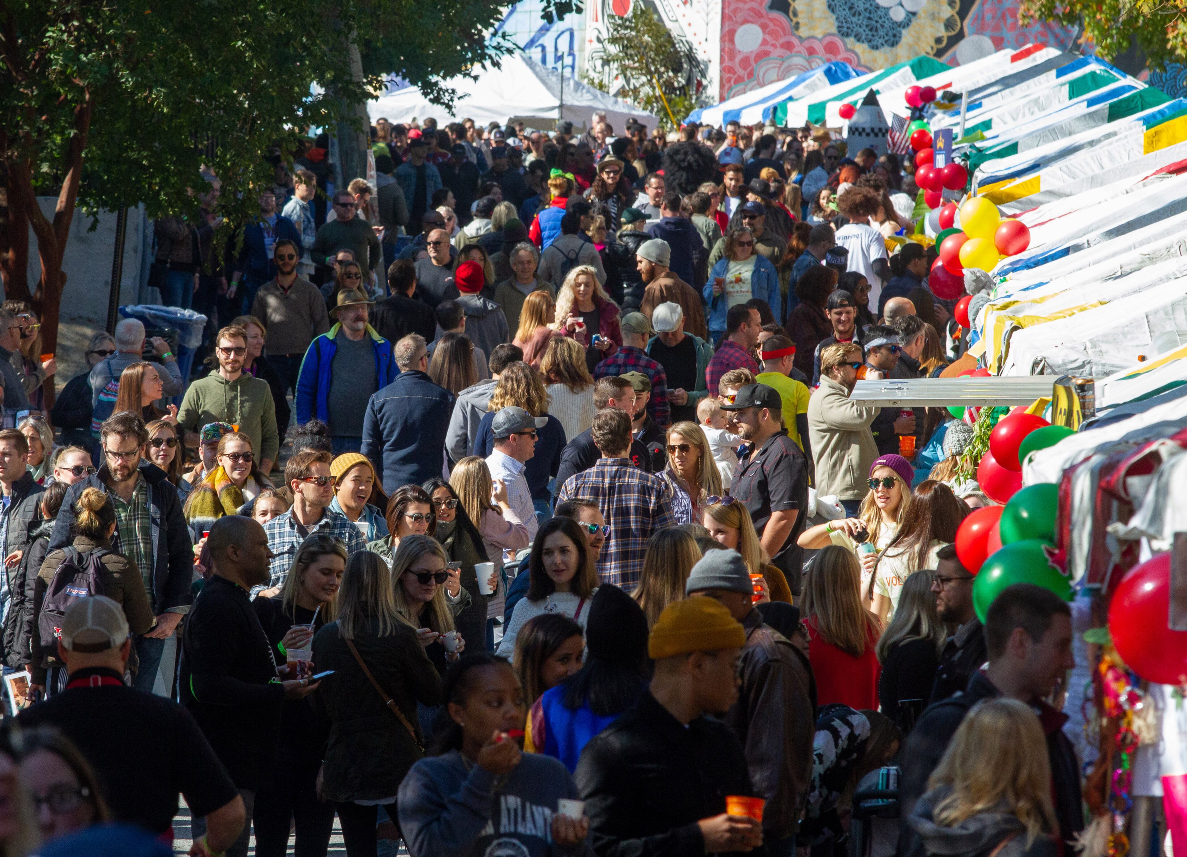 A large crowd packs Wylie Street in front of the chili team booths during the Chomp & Stomp Chili Cook-off and Bluegrass Festival in Cabbagetown on Saturday, November 2, 2019. STEVE SCHAEFER / SPECIAL TO THE AJC