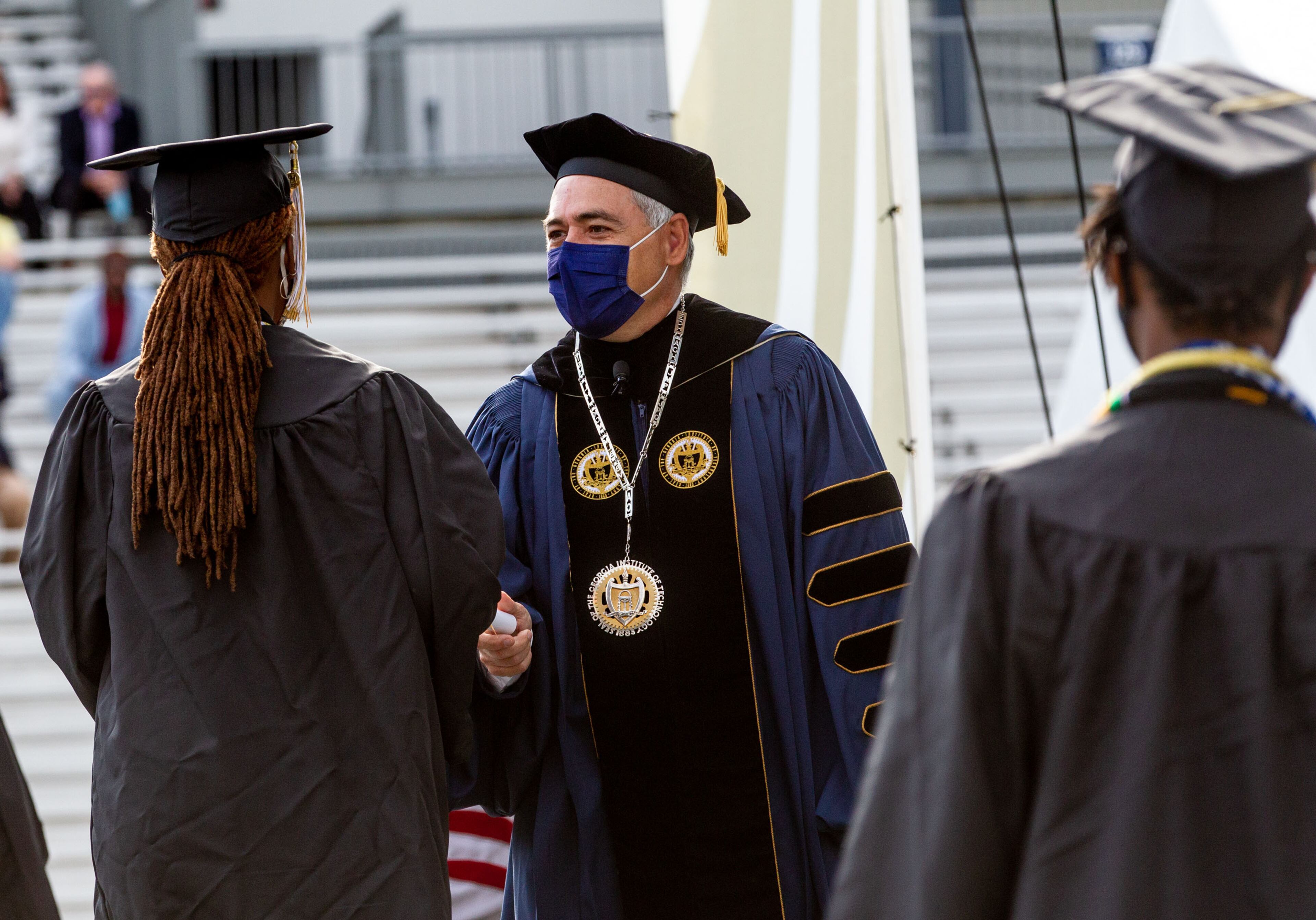 Georgia Tech President Ángel Cabrera hands out diplomas during the 2021 commencement ceremony at Bobby Dodd Stadium on Saturday, May 8, 2021. Two ceremonies were held Saturday for bachelor’s degree recipients, and master's and doctoral graduates' ceremonies were held Friday. (Photo: Steve Schaefer for The Atlanta Journal-Constitution)