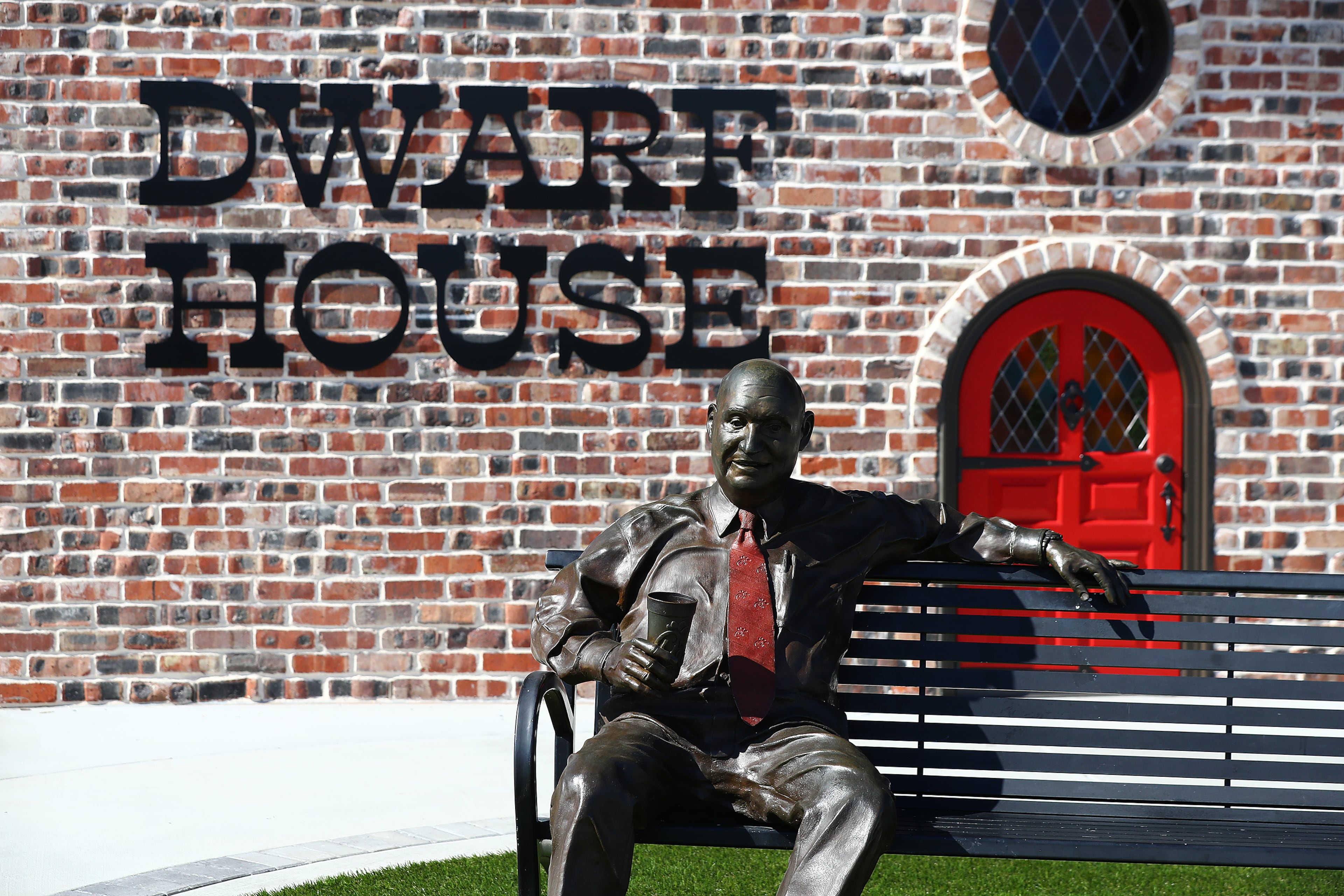 021422 Hapeville: A statue of Chic-fil-A Founder S. Truett Cathy sits on a bench outside the newly renovated Dwarf House, the first of his restaurants, on Monday, Feb. 14, 2022, in Hapeville. “Curtis Compton / Curtis.Compton@ajc.com”`
