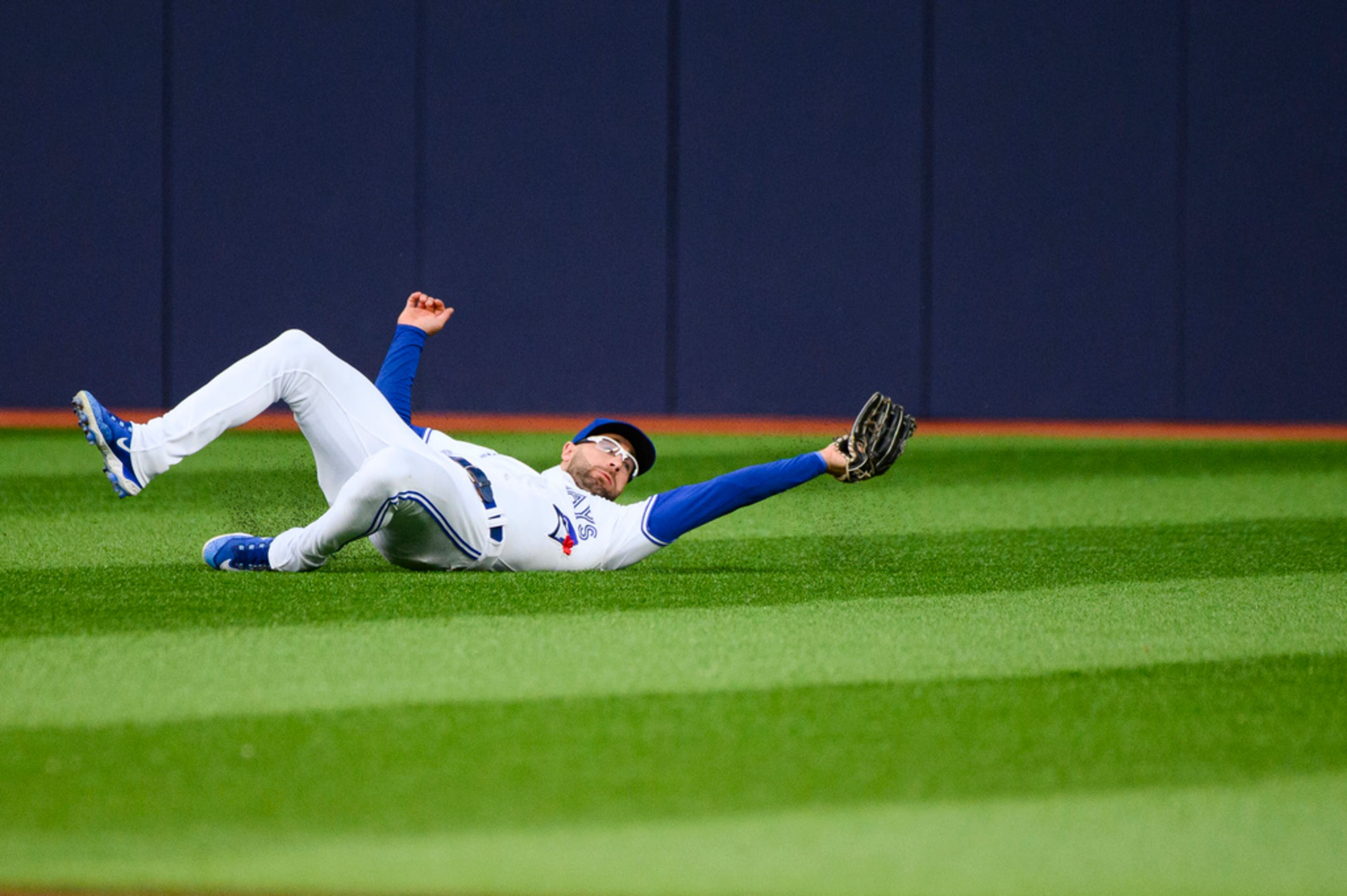 Toronto Blue Jays center fielder Kevin Kiermaier catches a fly ball by Atlanta Braves' Travis d'Arnaud during third-inning baseball game action in Toronto, Friday, May 12, 2023. (Christopher Katsarov/The Canadian Press via AP)