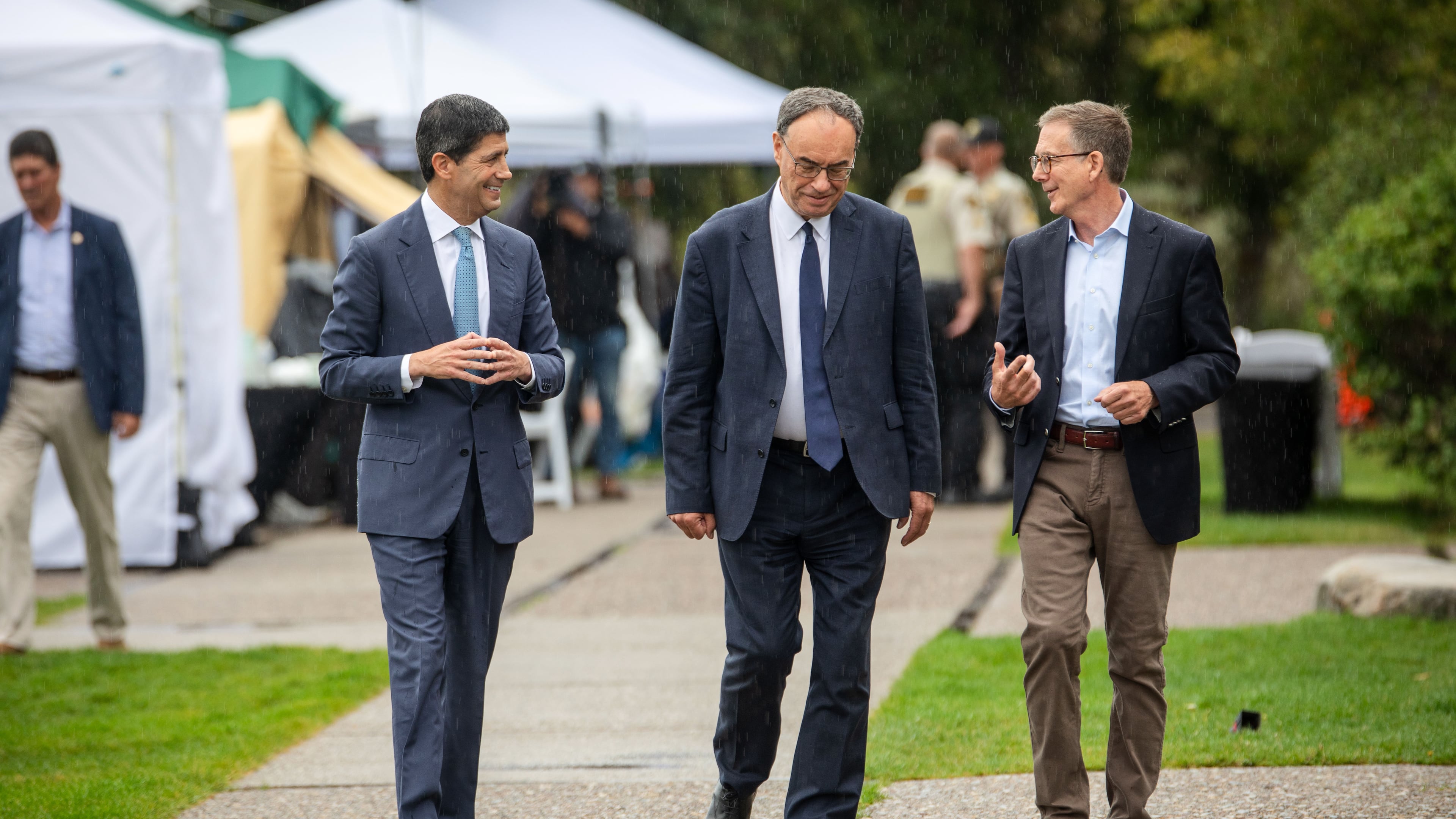 Fed Chair Kevin Warsh, left, Bank of England Governor Andrew Bailey, middle, and Bank of Canada Governor Tiff Macklem arrive at the annual Jackson Hole Economic Policy Symposium on Friday, Aug. 28, 2026, in Moran, Wyo. (AP Photo/Amber Baesler)