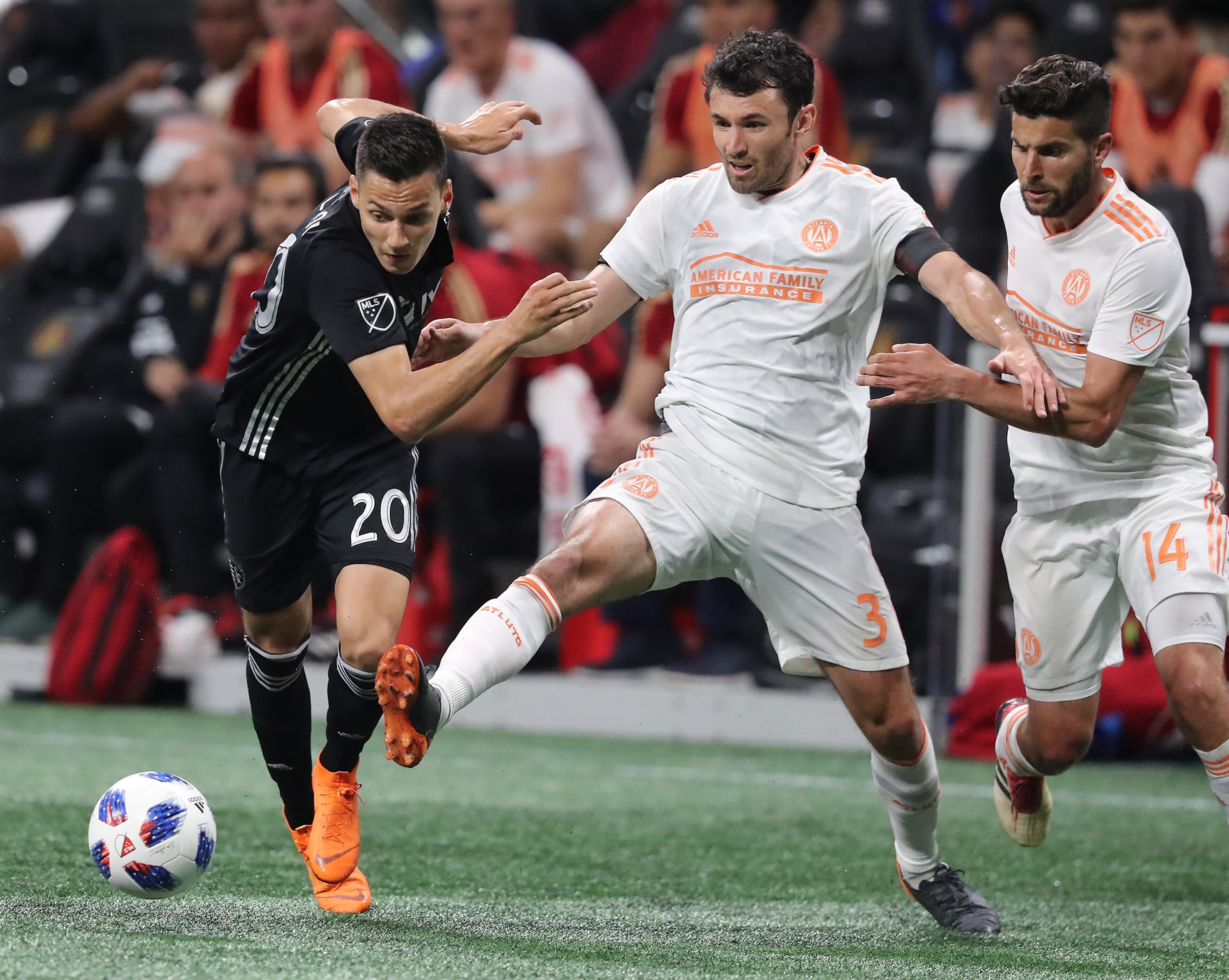 May 9, 2018 Atlanta: Atlanta United defender Michael Parkhurst kicks the ball away from Sporting Kansas City forward Daniel Salloi during the second half in a MLS soccer match on Wednesday, May 9, 2018, in Atlanta. Curtis Compton/ccompton@ajc.com