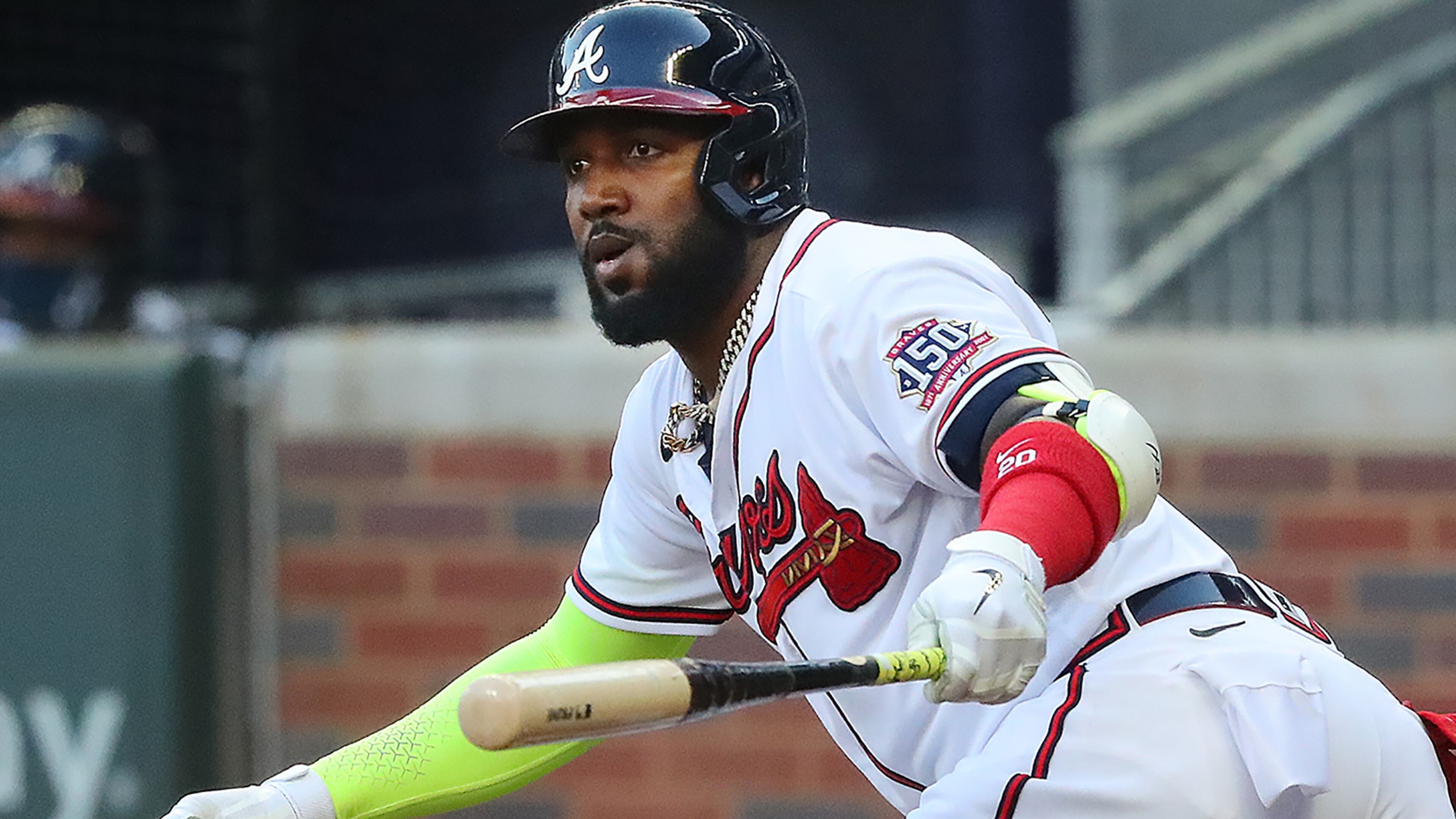 Braves outfielder Marcell Ozuna hits a double that advanced Freddie Freeman against the Chicago Cubs during the first inning Monday, April 26, 2021, at Truist Park in Atlanta. The Braves scored four runs in the inning. (Curtis Compton / Curtis.Compton@ajc.com)