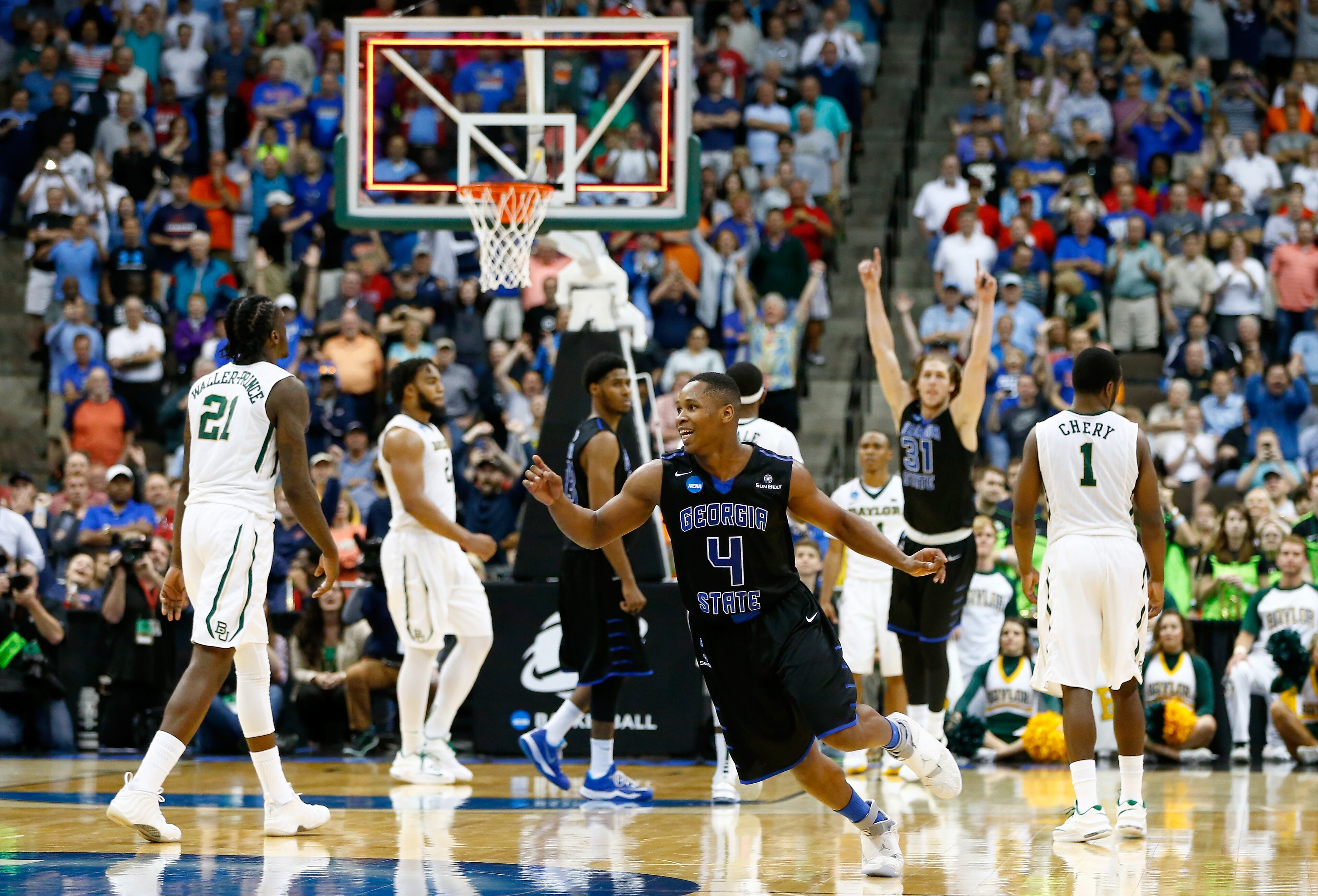Isaiah Dennis #4 and T.J. Shipes #31 of the Georgia State Panthers celebrate after the Panthers win 57-56 against the Baylor Bears in the second round of the 2015 NCAA Men's Basketball Tournament at Jacksonville Veterans Memorial Arena on March 19, 2015 in Jacksonville, Florida. (Photo by Kevin C. Cox/Getty Images)