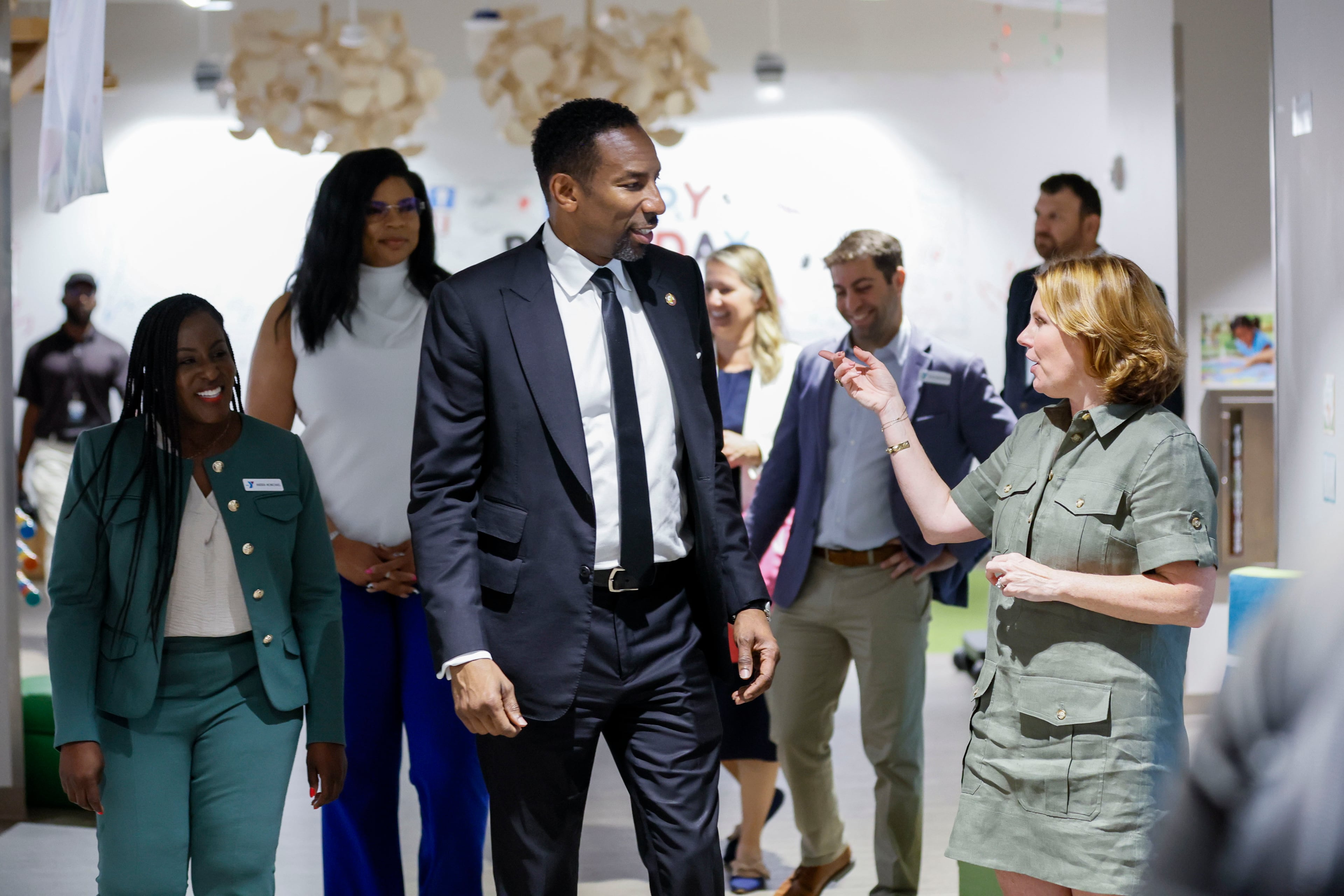 YMCA President and CEO Lauren Koontz, right, explains to Atlanta Mayor Andre Dicken all the programs run at the Arthur M. Blank Early Learning Center during a tour at a celebration of the 60th anniversary of the federal Head Start program on Monday. (Miguel Martinez/AJC)
