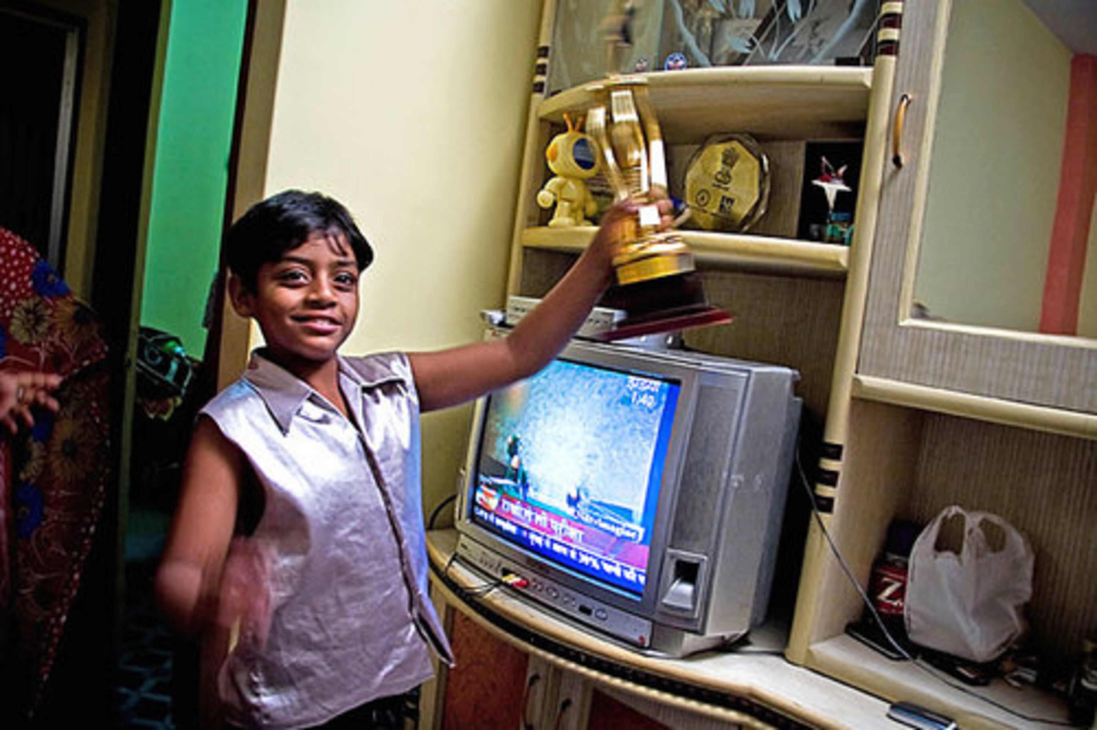 Mohammed Azharuddin Ismail celebrates his newly allocated 250-square-foot apartment by 'Jai Ho' trust in Santacruz in the western Mumbai suburbs.