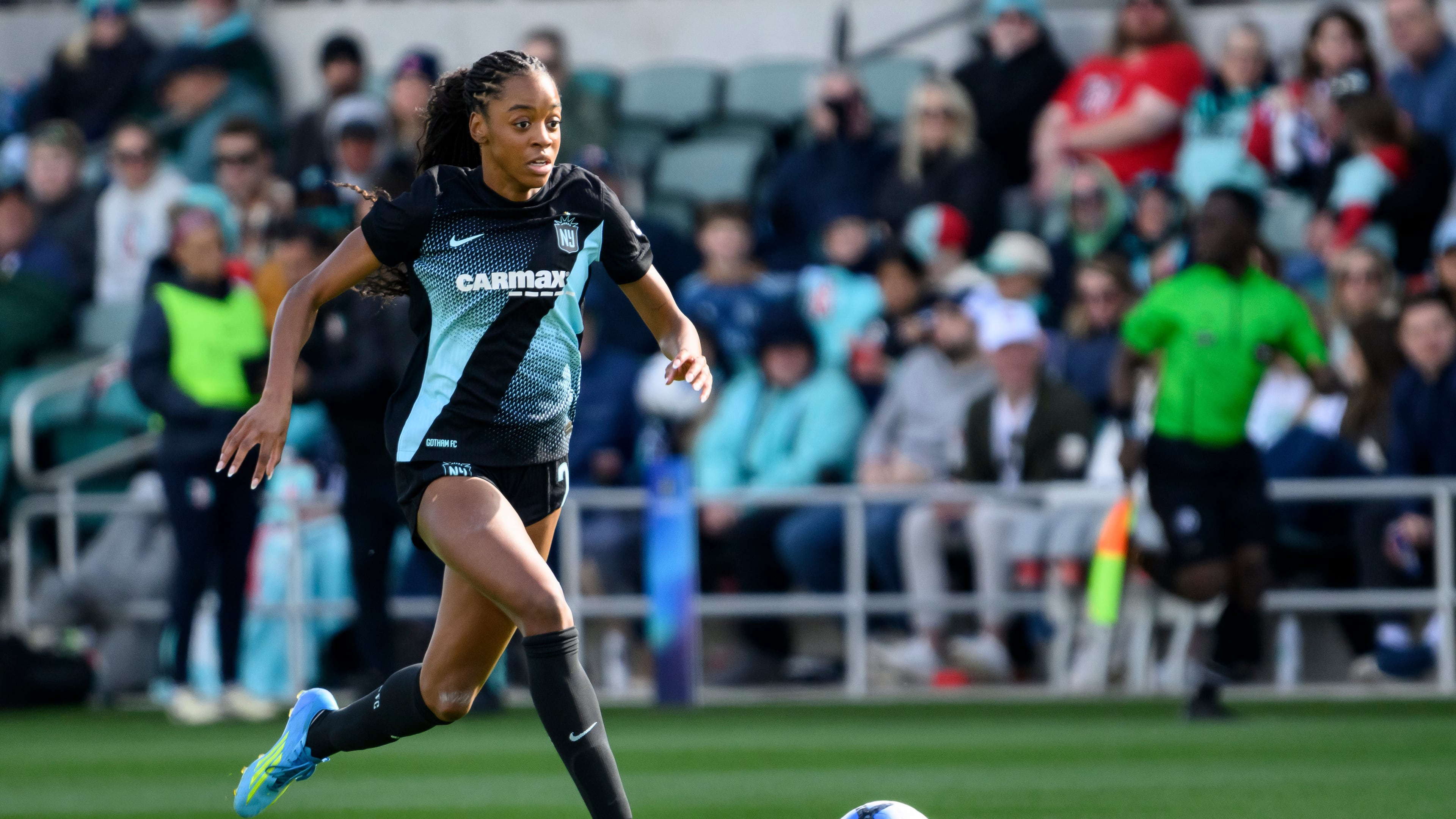 FILE- Gotham FC forward Jordynn Dudley brings the ball upfield against the Kansas City Current during an NWSL soccer match, April 4, 2026, in Kansas City, Mo. (AP Photo/Reed Hoffmann, File)