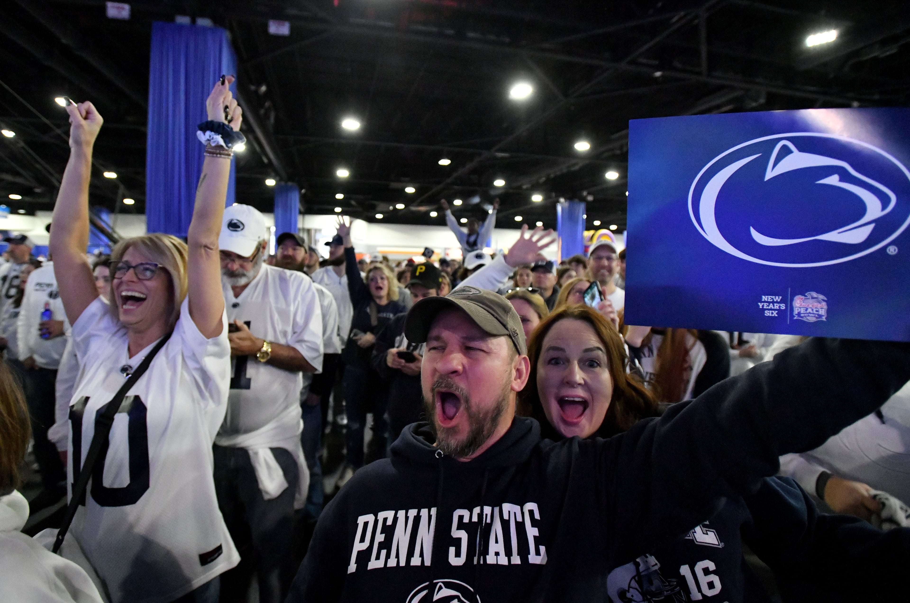 Penn State fans get fired up during Peach Bowl pep rally at Georgia World Congress Center prior to 2023 Chick-fil-A Peach Bowl between Ole Miss and Penn State, Saturday, December 30, 2023, in Atlanta. (Hyosub Shin / Hyosub.Shin@ajc.com)