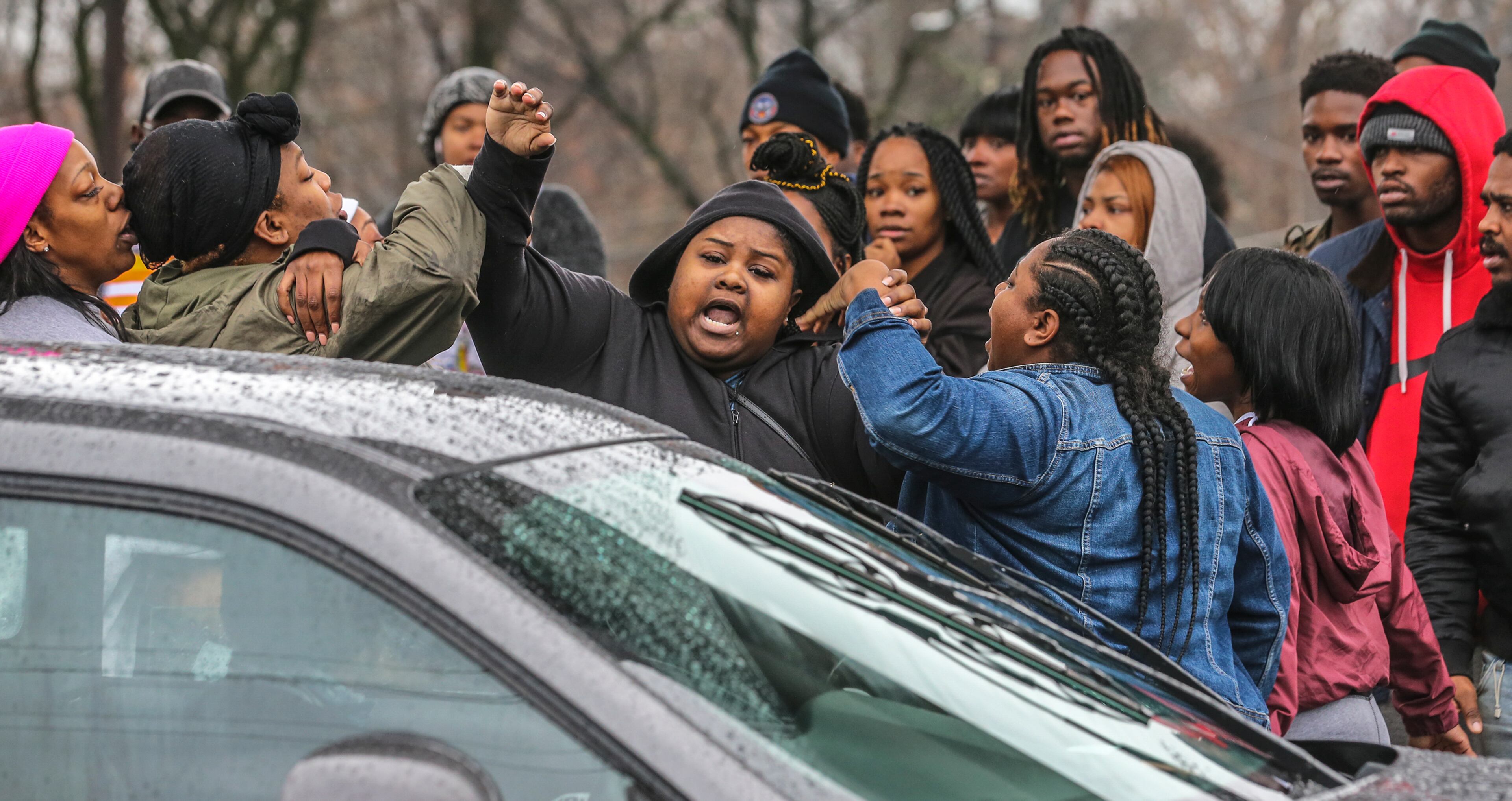 The crowd became agitated and began shoving and shouting when a gray Dodge pulled up to the scene that police made leave the scene after two men were found shot to death in southwest Atlanta on Thursday morning, Jan. 3, 2019. Officers found them inside a vehicle near the corner of Lee and Whitehall streets after responding to a call of a person shot about 7:15 a.m., Atlanta police spokesman Officer Jarius Daugherty said. The men were pronounced dead at the scene. âHomicide investigators worked to determine the circumstances surrounding the shooting,â Daugherty said.Â