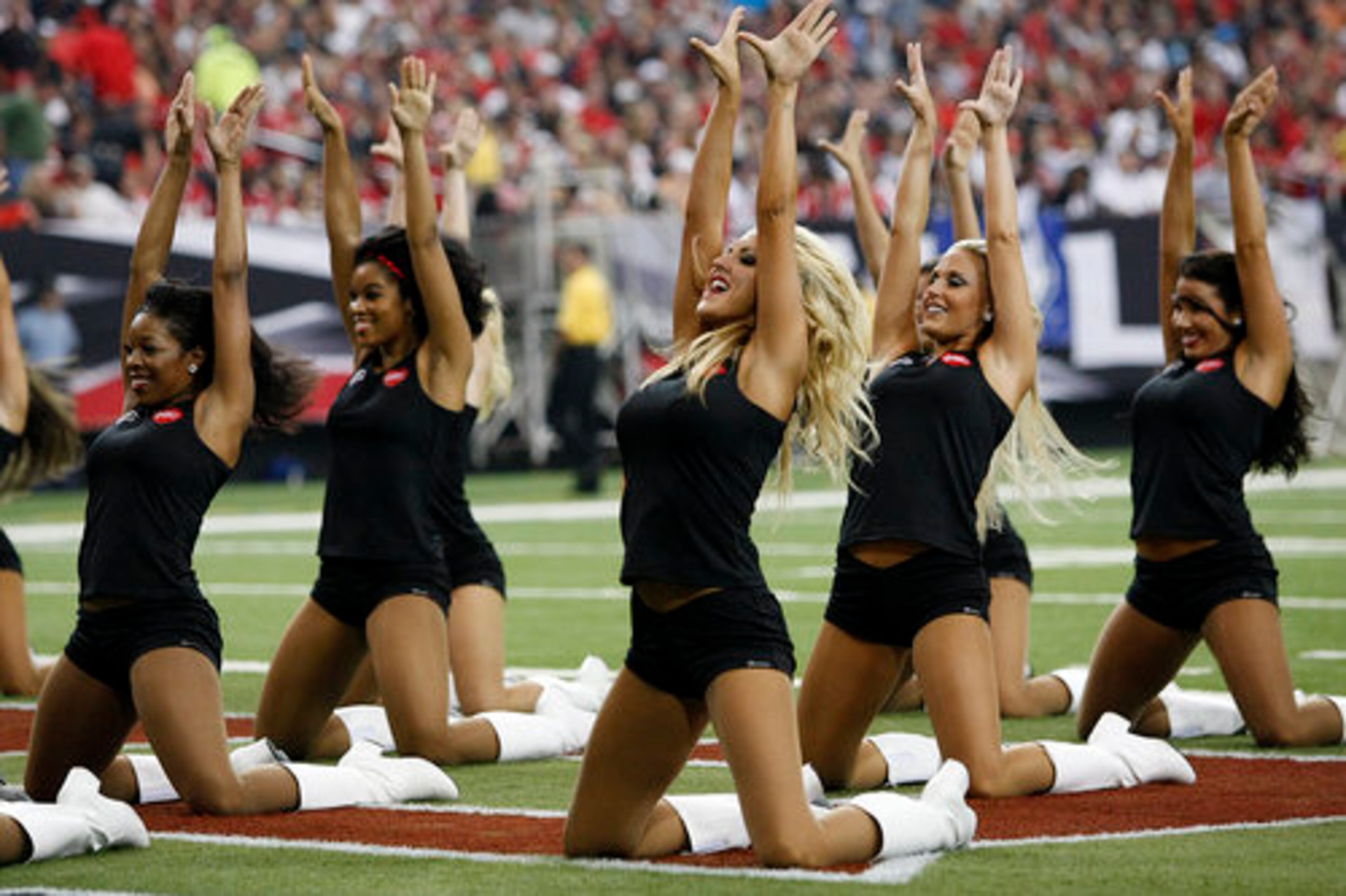 Cheerleaders support the Falcons Sunday at the Georgia Dome.