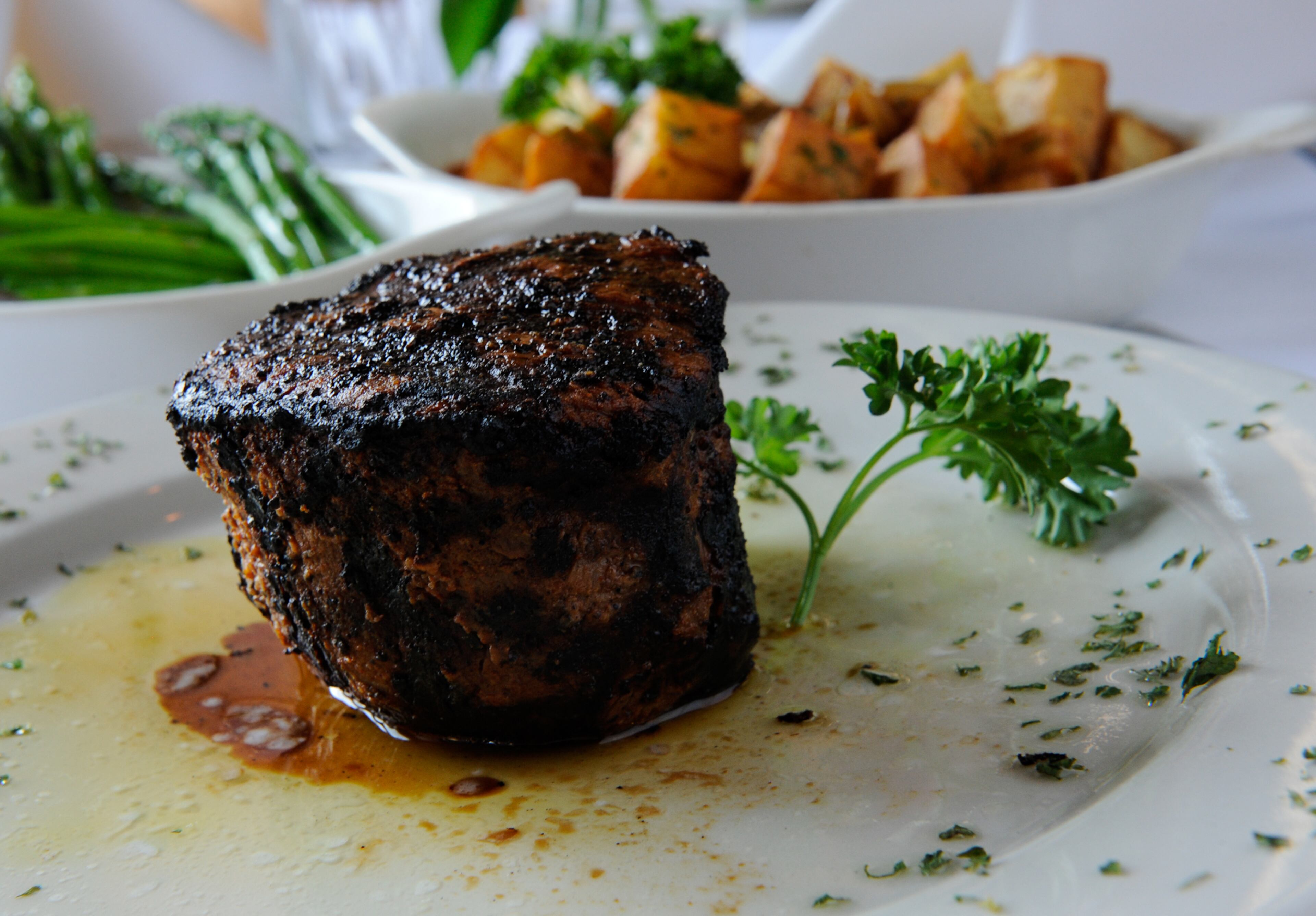 Filet Mignon 12 oz. grilled and finished with a butter sauce, served with asparagus and barbant potatoes at Hal's on Old Ivy. (BECKY STEIN/special)