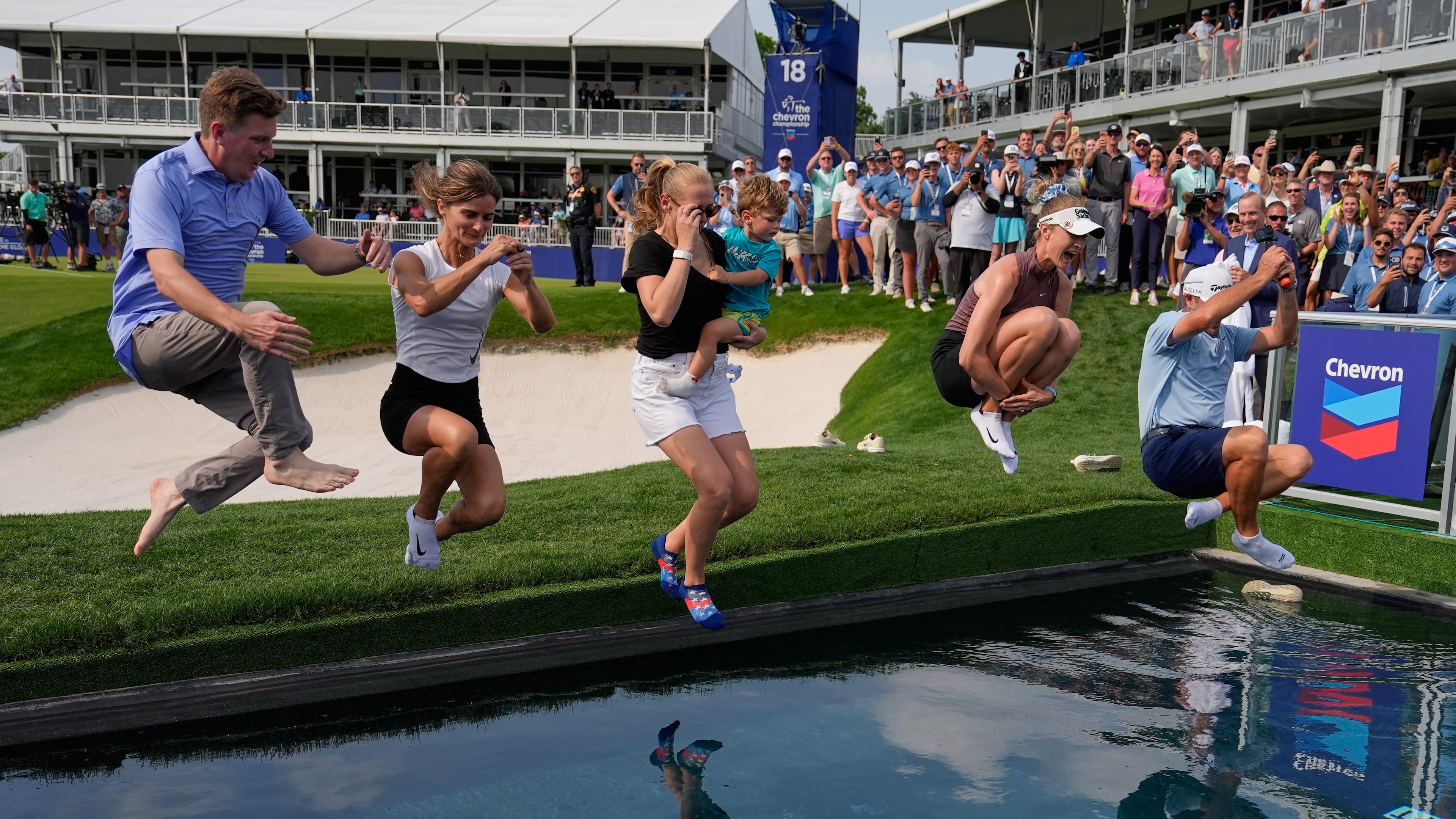 Nelly Korda celebrates by jumping in the water after winning the Chevron Championship LPGA golf tournament Sunday, April 26, 2026, in Houston. (AP Photo/Ashley Landis)