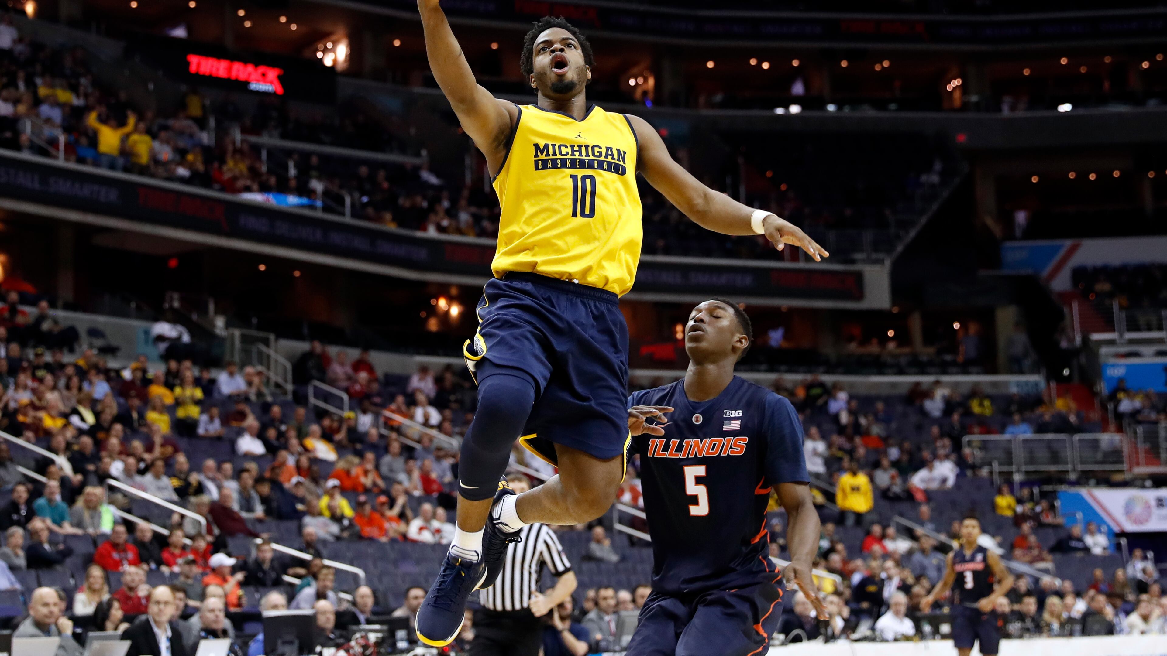 Michigan wore their reversible practice jerseys with "Michigan basketball" on the front and no last names on the back during a 75-55 win over Illinois.