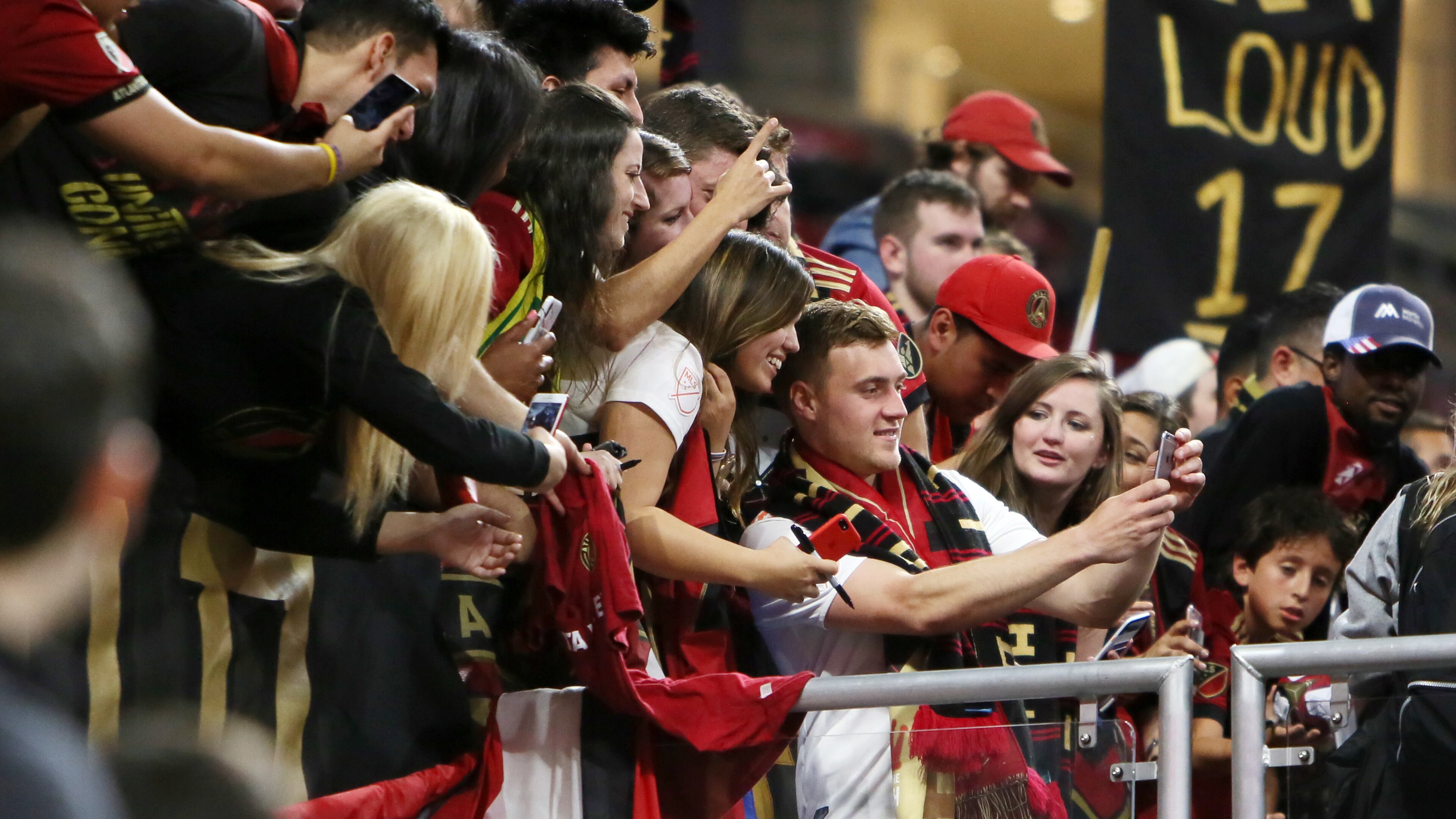 April 7, 2018. Atlanta United midfielder Julian Gressel takes selfies with fans, he was name best player of the match after scoring a goal and one assist.