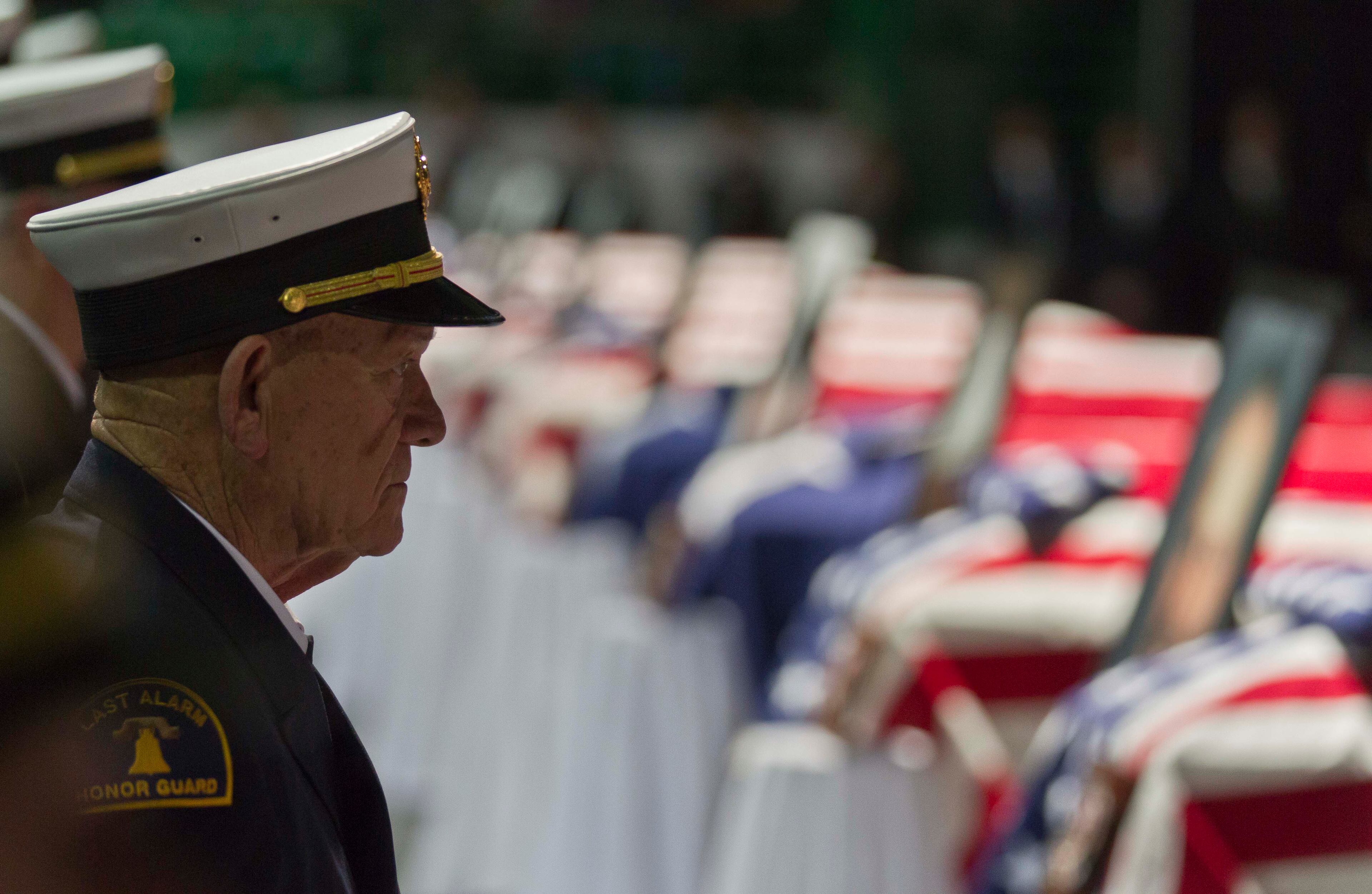 A Firefighter Honor Guard prepares to salute a dozen caskets during a memorial service for victims of the fertilizer plant explosion in West, Texas, Thursday, April 25, 2013, in Waco.