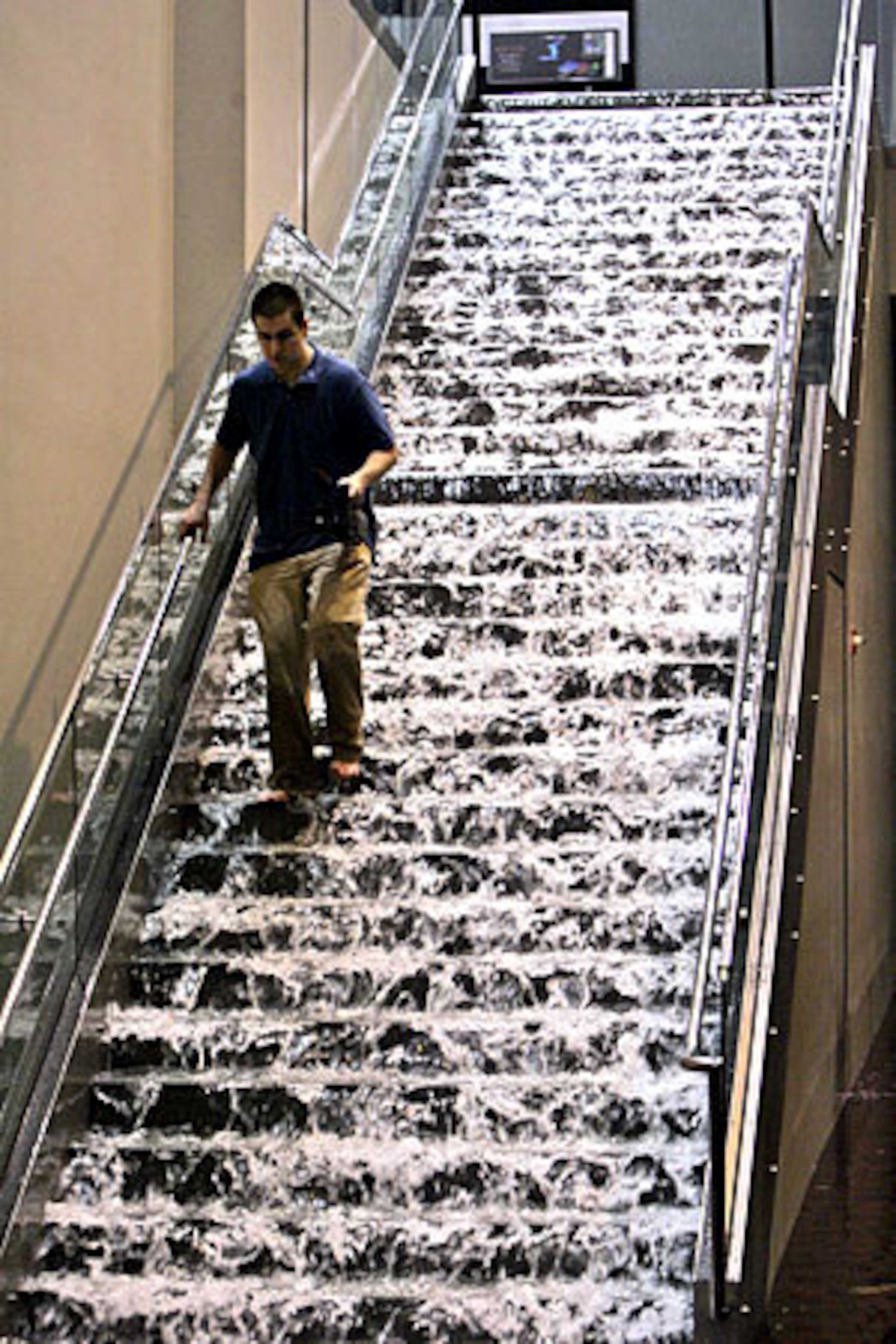 Water pours down the steps at the Georgia World Congress Center in the aftermath of the storm.