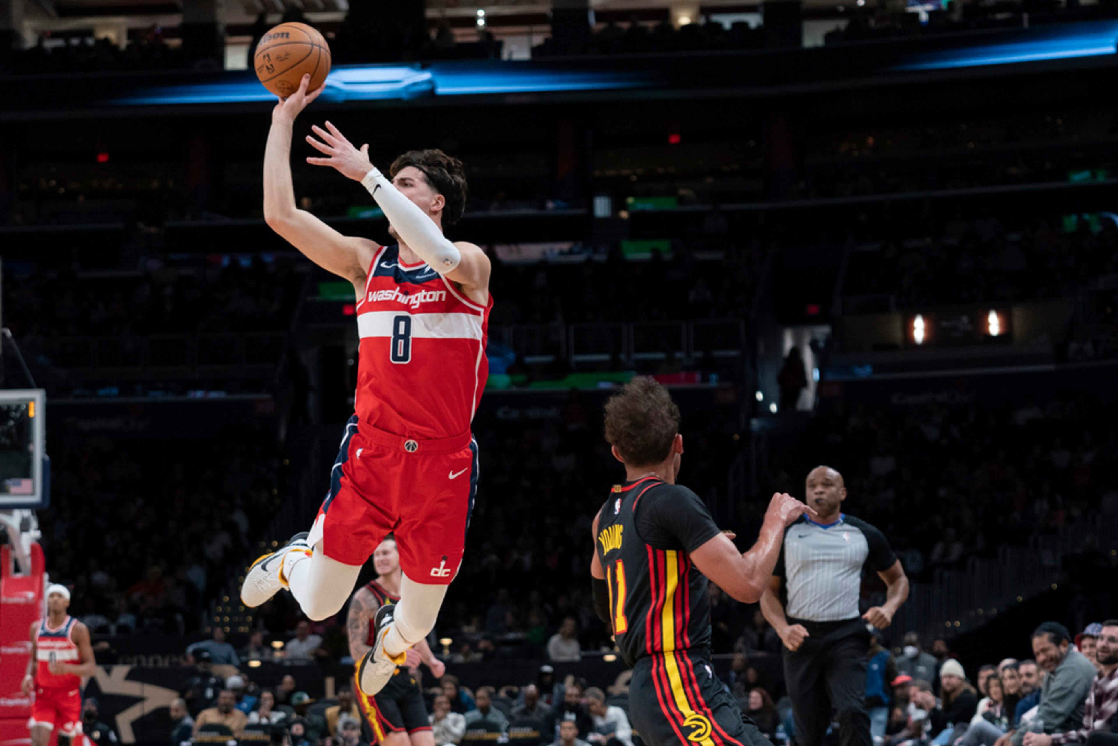 Washington Wizards' Deni Avdija (8) goes for a 3-point basket against the Atlanta Hawks during the first half of an NBA basketball game Sunday, Dec. 31, 2023, in Washington. (AP Photo/Jose Luis Magana)