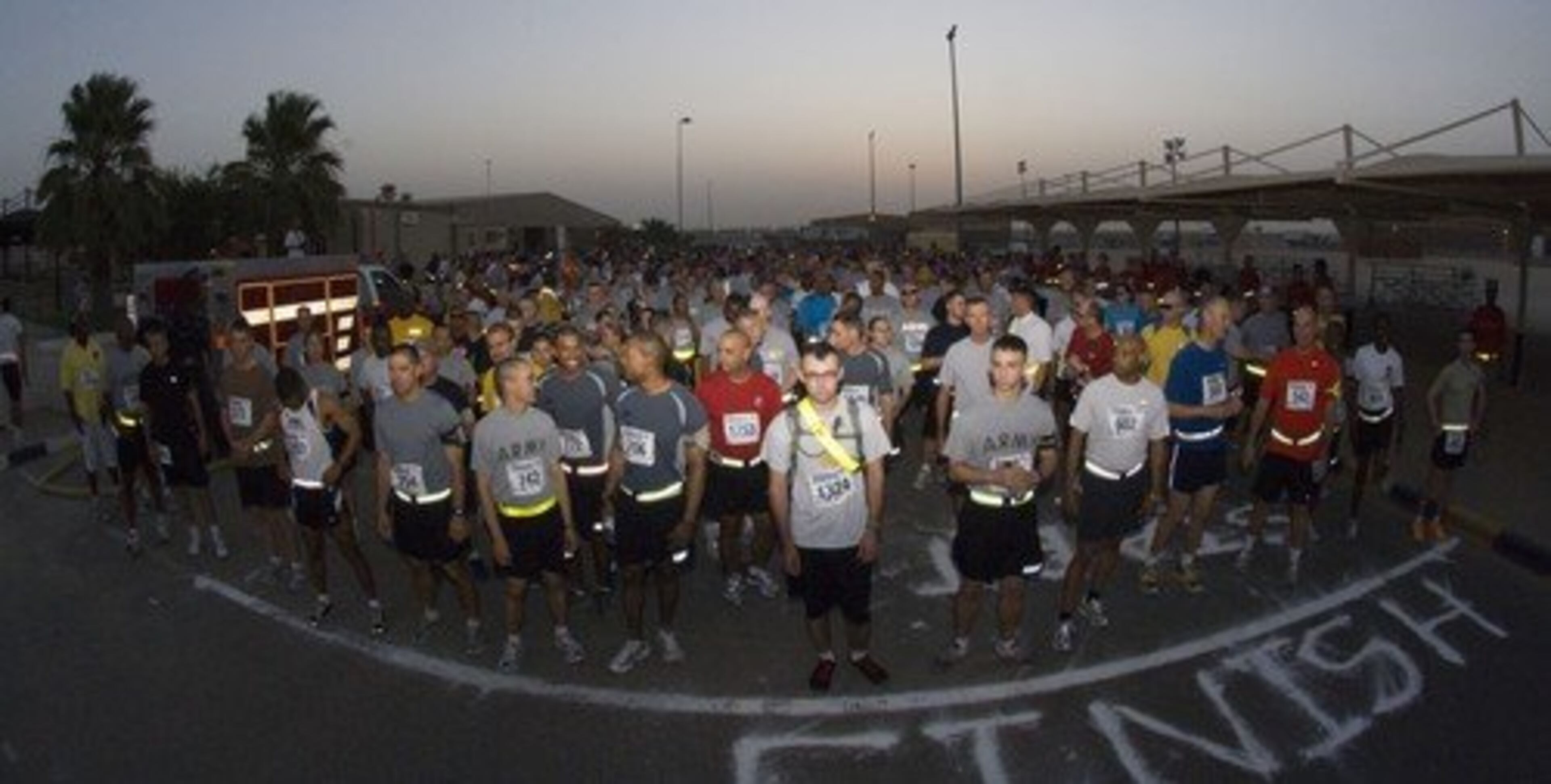 Armed service members prepare for a remote start of the Peachtree Road Race with on July 4, 2010, at Camp Arifjan, Kuwait.